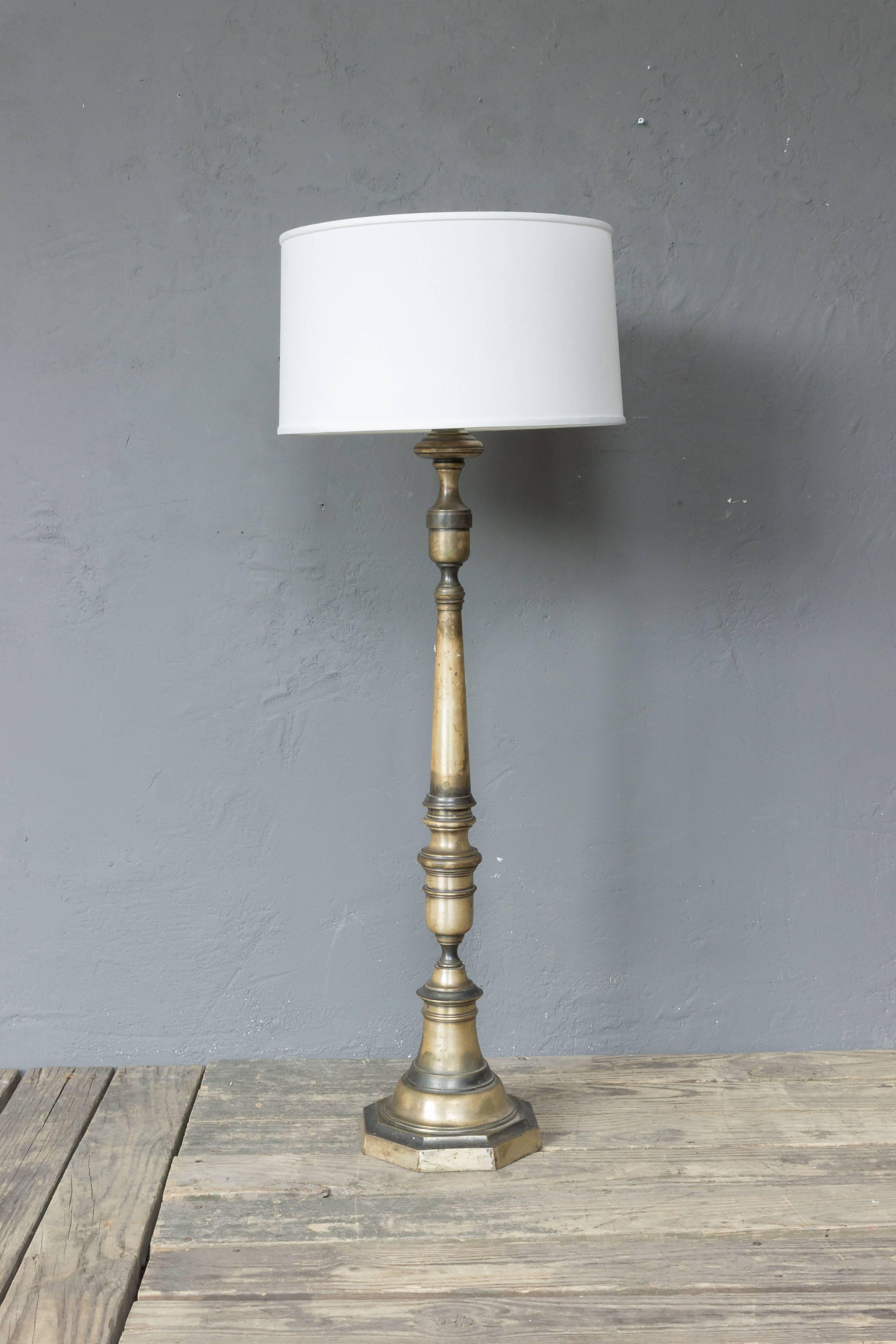 Silvered bronze floor lamp with patinated finish. Silvered bronze floor lamp with patinated finish. Very good quality. French, 1940s. Price includes hand polishing and new wiring. The plating is original and shows tarnishing and wear. The item is