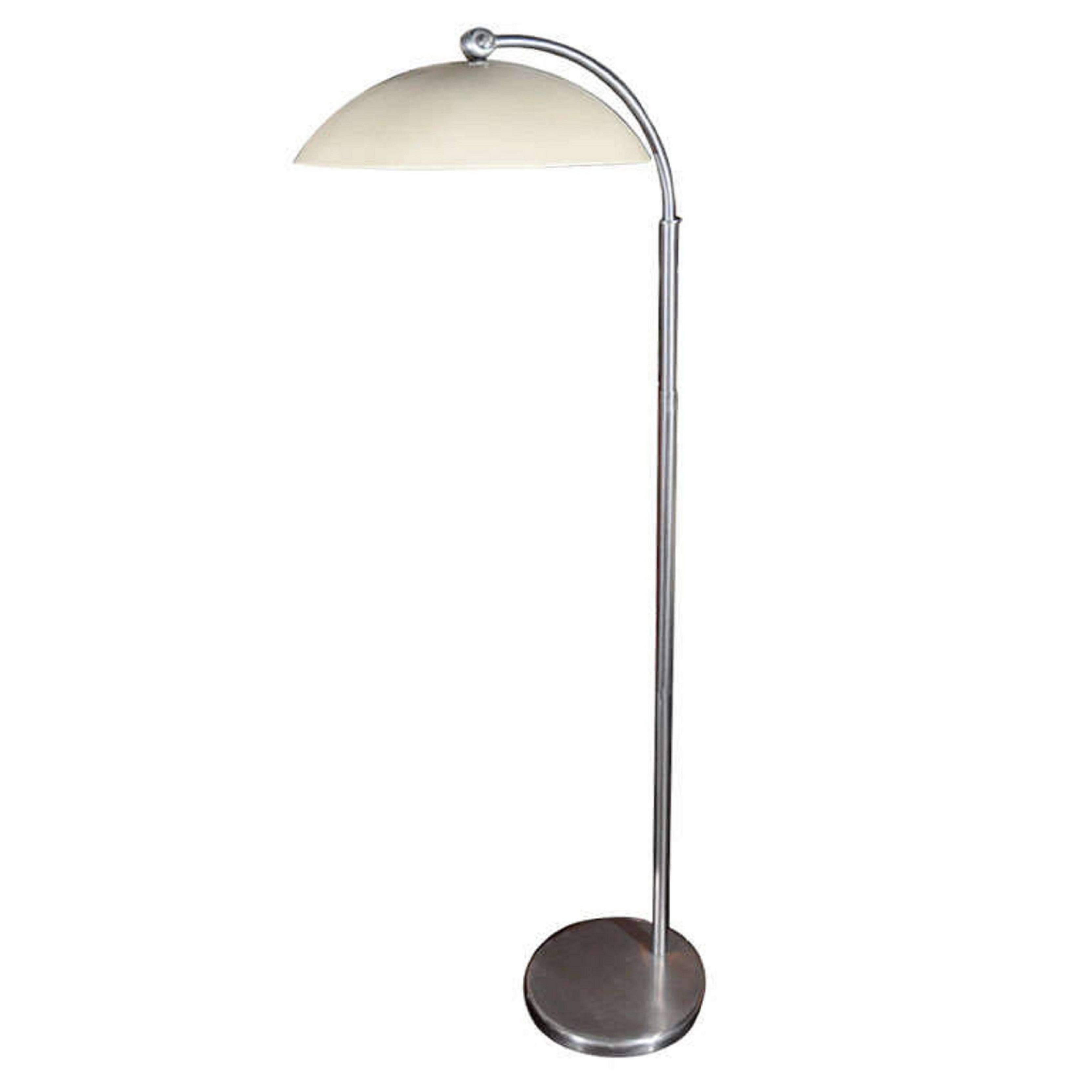 Standing lamp in stained chrome with painted aluminum dome shade, with circular base, by Walter Von Nessen, American, 1940s. Rare. Measures: Height 59 1/2 in., diameter of shade 15 1/2 in. 