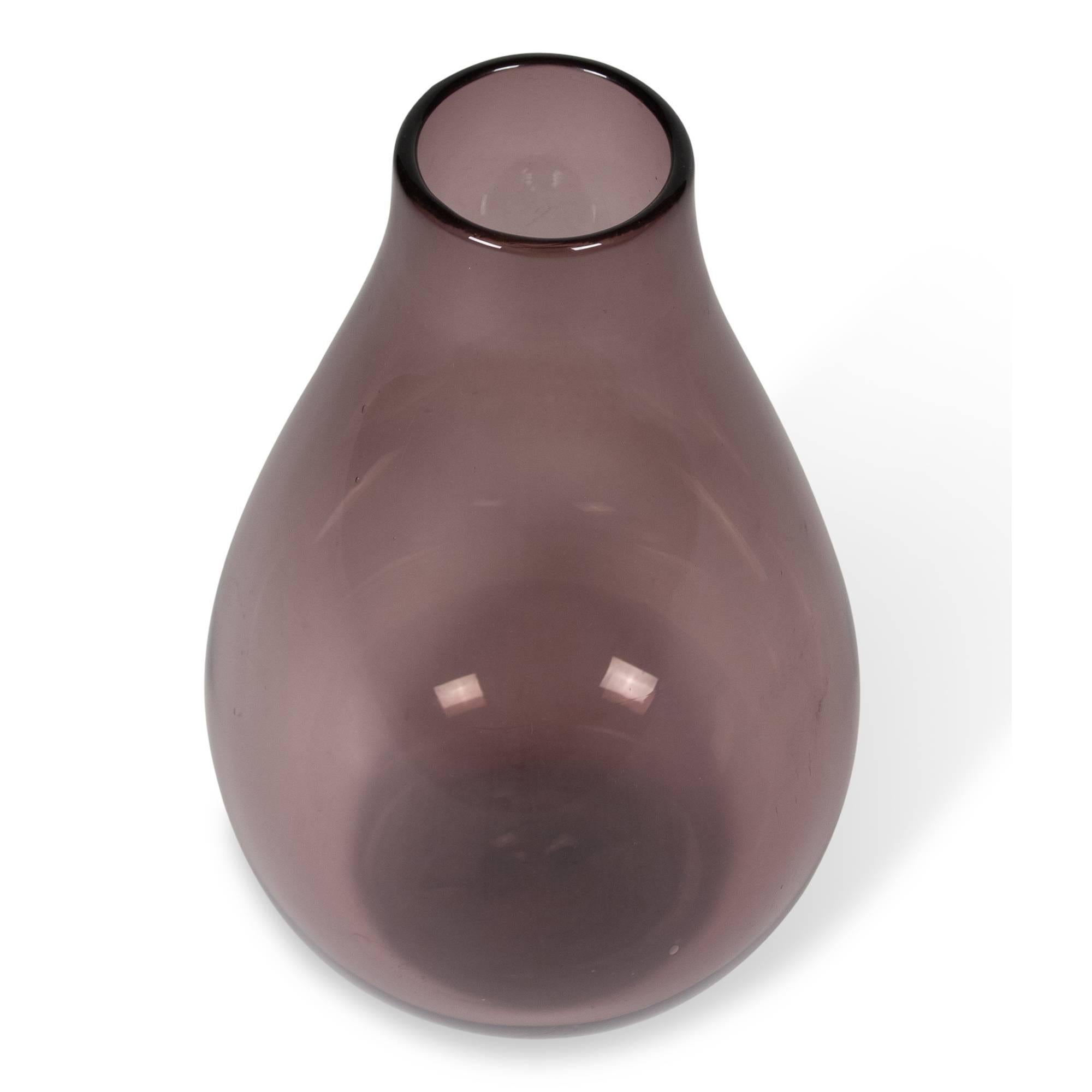Large purple/aubergine colored glass vase, with a few scattered bubble inclusions, Murano, Italian, 1960s. Measures: 10 in. D at widest, 17 in. H. Unmarked. 