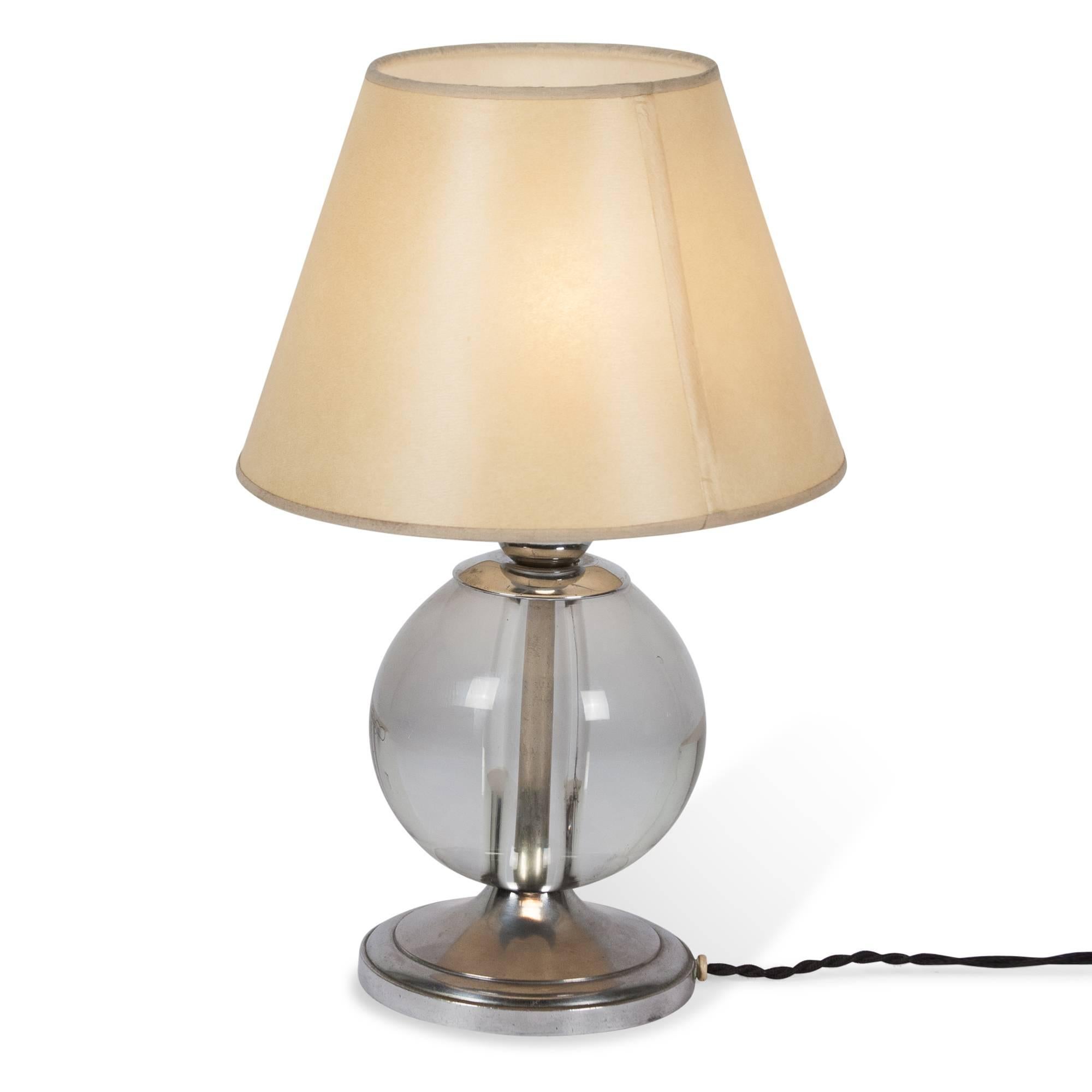 Crystal ball lamp, the ball mounted on a nickel base, with a custom paper shade, attributed to Jacques Adnet, French, 1930s. Measures: 5.5” D base, 14” H, 9” D shade at widest. 