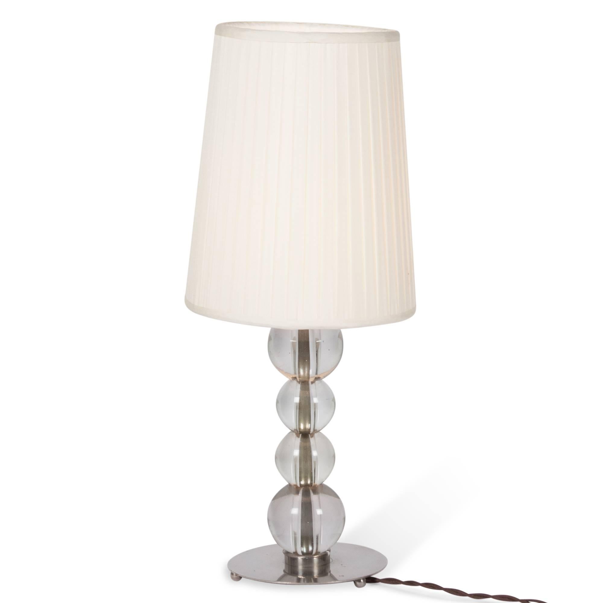 Stacked glass ball and nickel table lamp, with ball feet, attributed to Jacques Adnet, France, 1930s. Measures: 5” D base, 17” H, 7” D shade at widest. (Item #3542) 