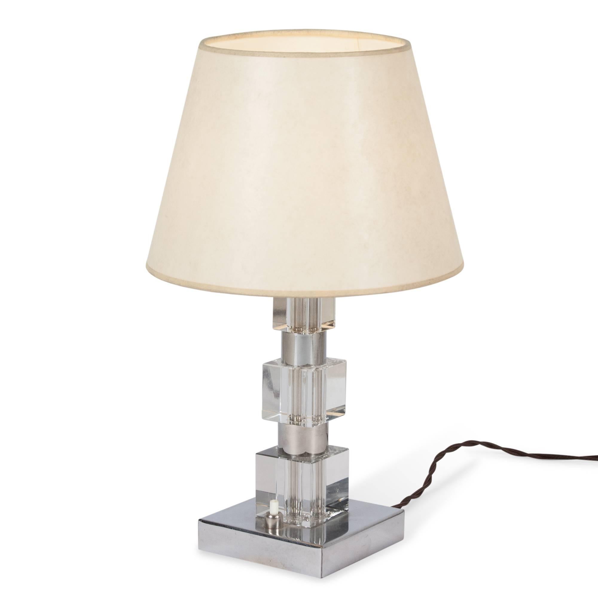 Chrome and glass desk lamp composed of alternating stacked cube forms, French 1930’s. Marked ‘PL, PRODUCTION FRANCAISE’ to underside. 4 in sq. base, 14 in h, 9 in d shade at widest. 