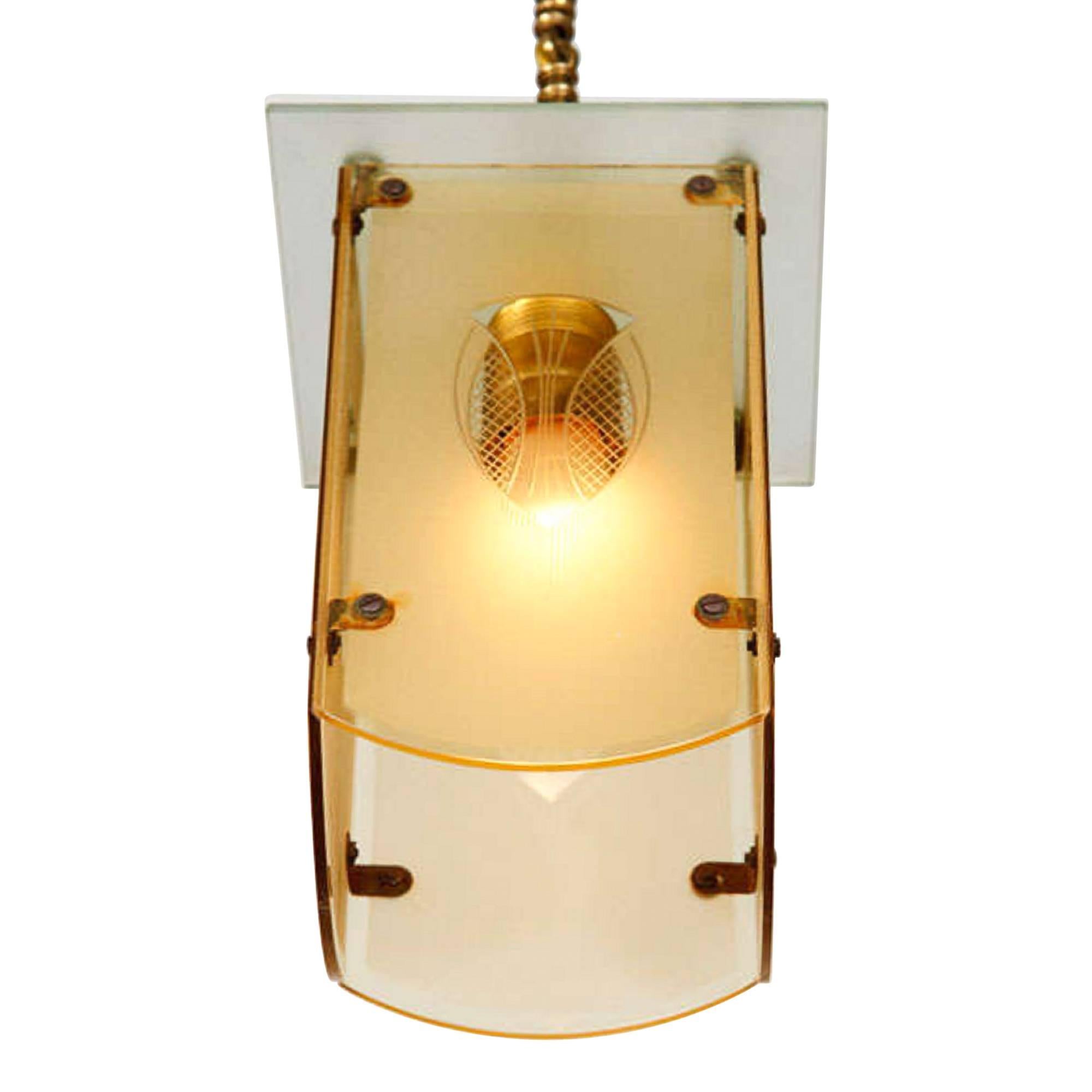 Hanging lamp, the glass shade with an Art Deco motif, German, 1920s. Suspended by a chain from the ceiling canopy. The fixture measures 6 in square, height 7 3/4 in. 