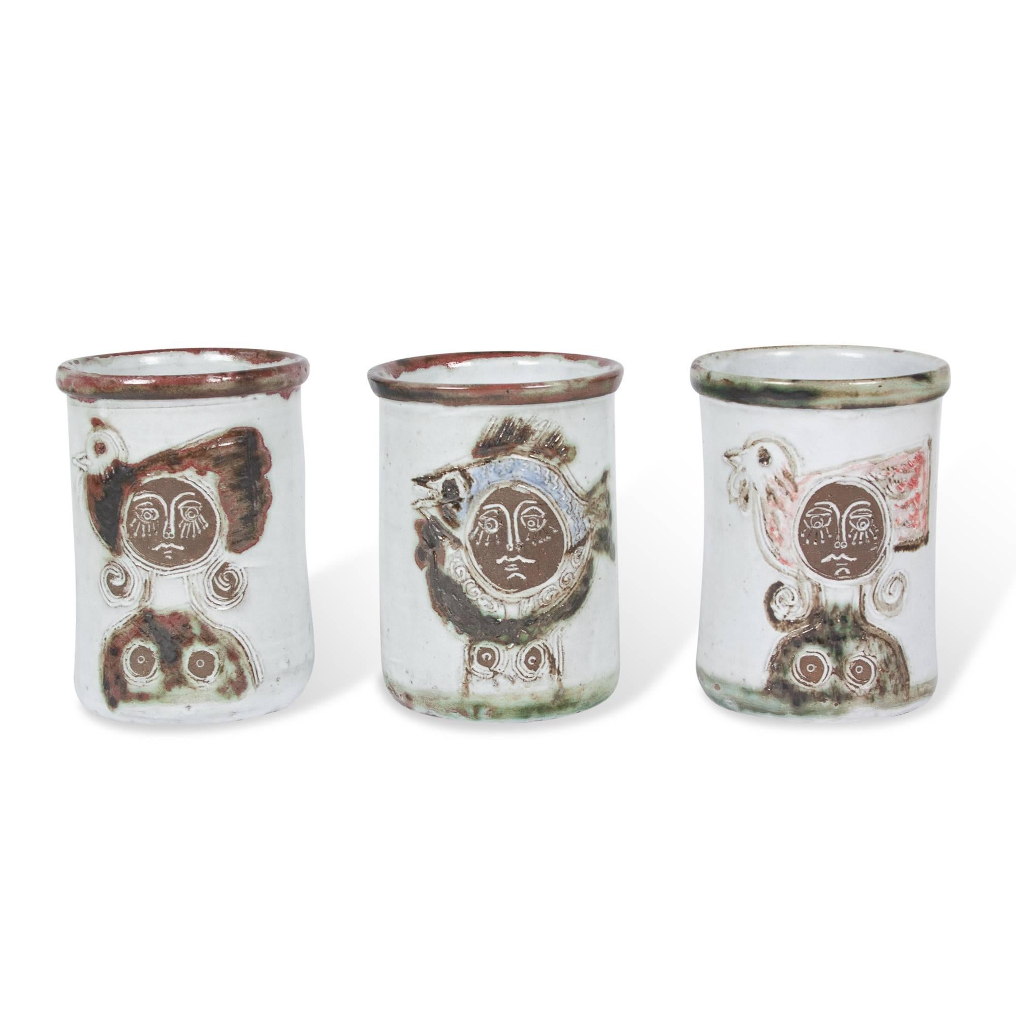 Glazed stoneware pots, each decorated with images of women and animals by Albert Thiry, French, circa 1950. Signature to underside. Measures: 4.5 in. D, 6 in. H.
   
Price for the set of three. Sold as a set or separately. Please inquire for