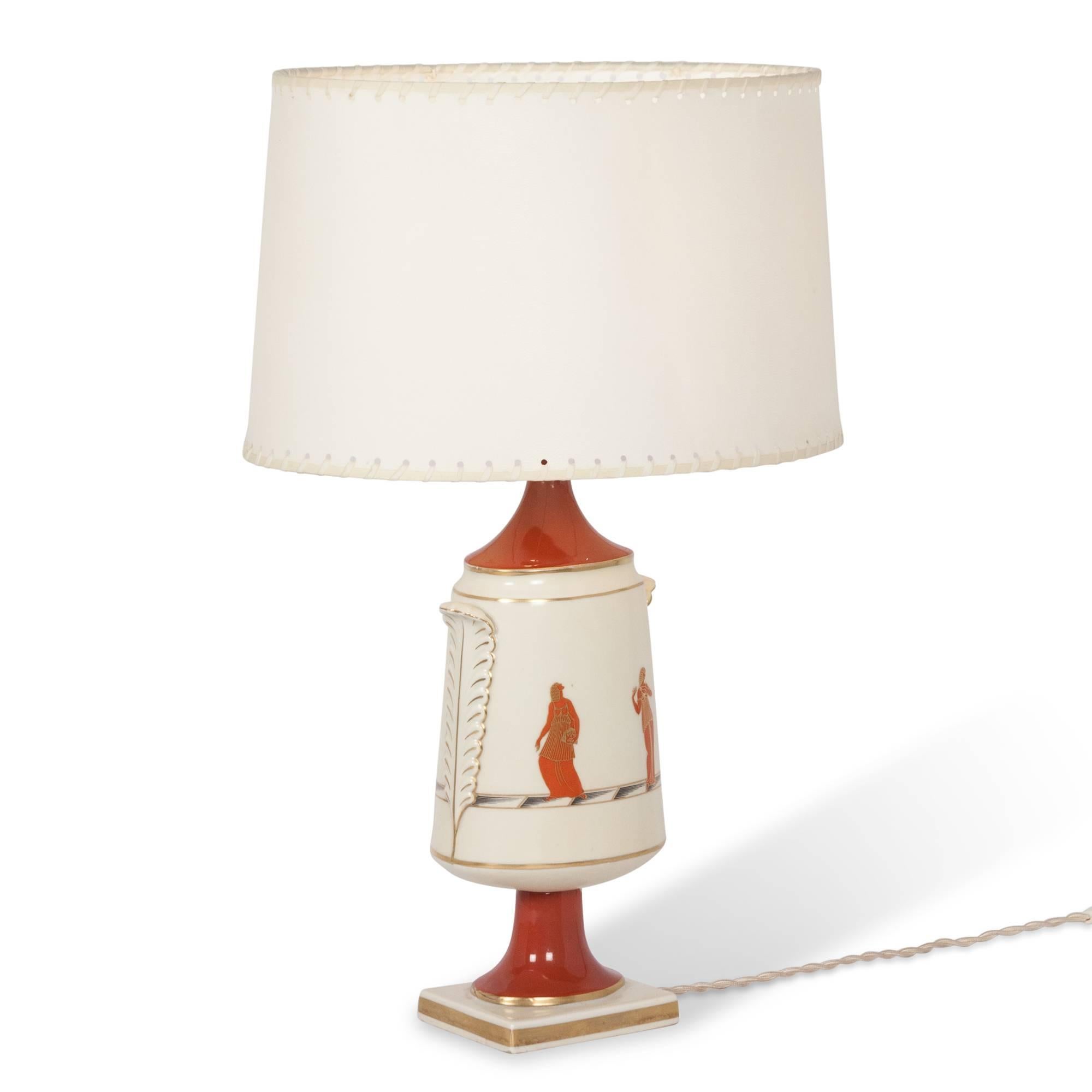 Ceramic table lamp decorated with a classical figural scene in a footed urn form by Gio Ponti for Ginori, Italian, 1920s. Shade diameter: 12 in. x 16 in. H x 4 in. base width. 

 