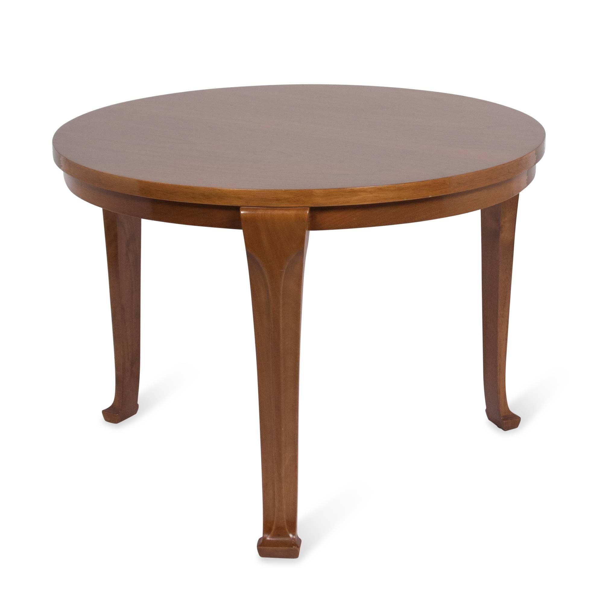Circular three-legged walnut end table by T.H. Robsjohn-Gibbings for Saridis; American designer for Greek company, 1960s. 24