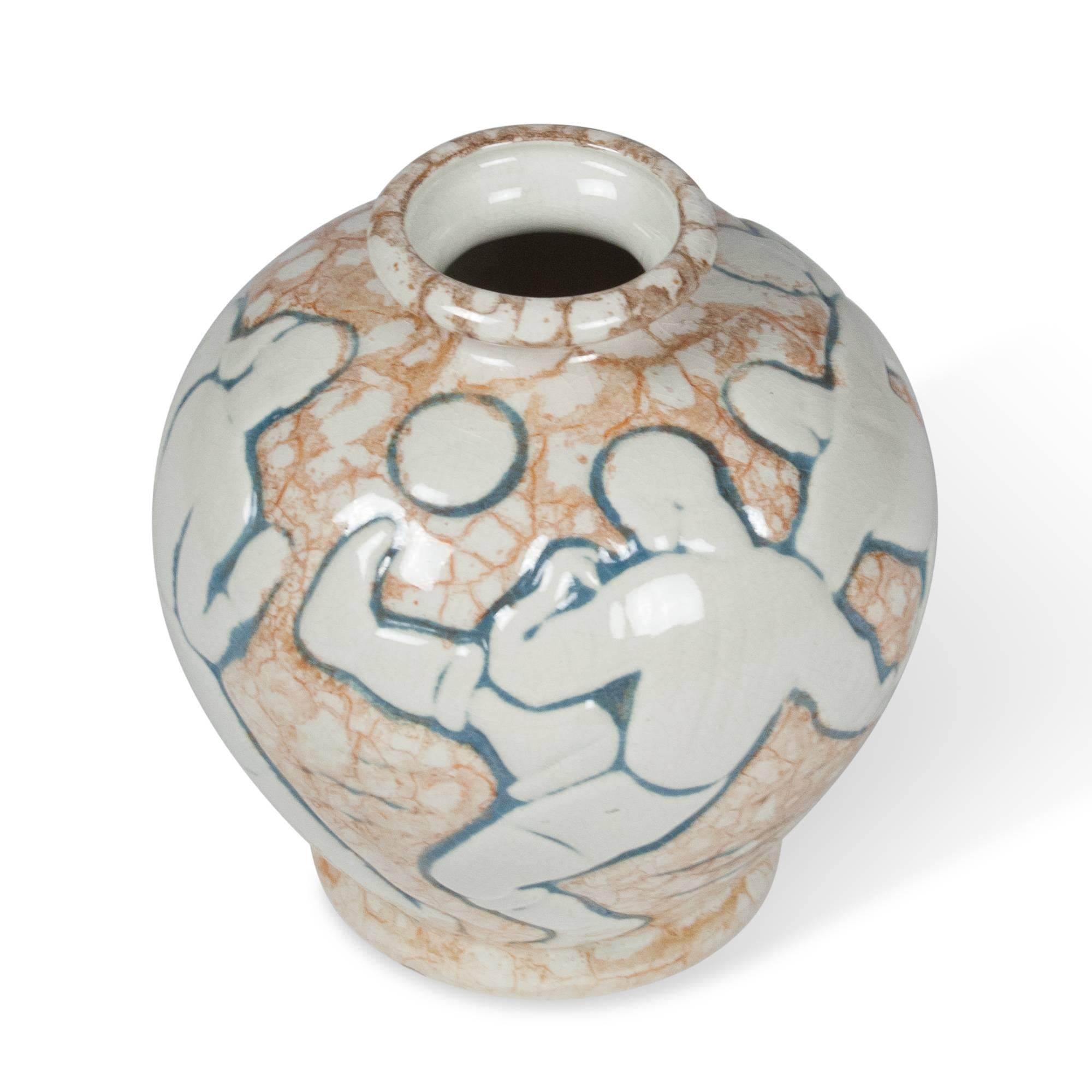 Urn-shaped, neutral-colored ceramic vase depicting figures playing soccer or European football, by Mougin Freres, France, 1930s. Signed. Measures: 7 1/2 in. height, 7 in. diameter.