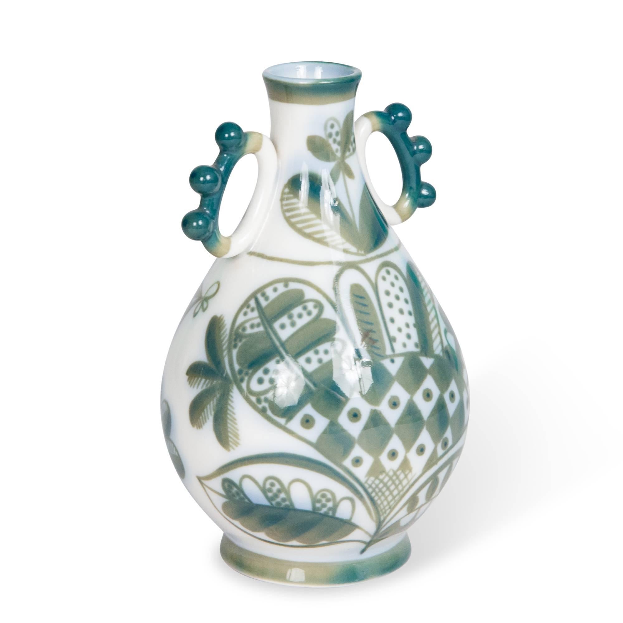 Small porcelain vase, with leaf pattern decoration and two small handles, by Leningrad Porcelain, Soviet Union, 1920s. Stamped to underside. Measures: Height 6 in, largest diameter 4 in.. 