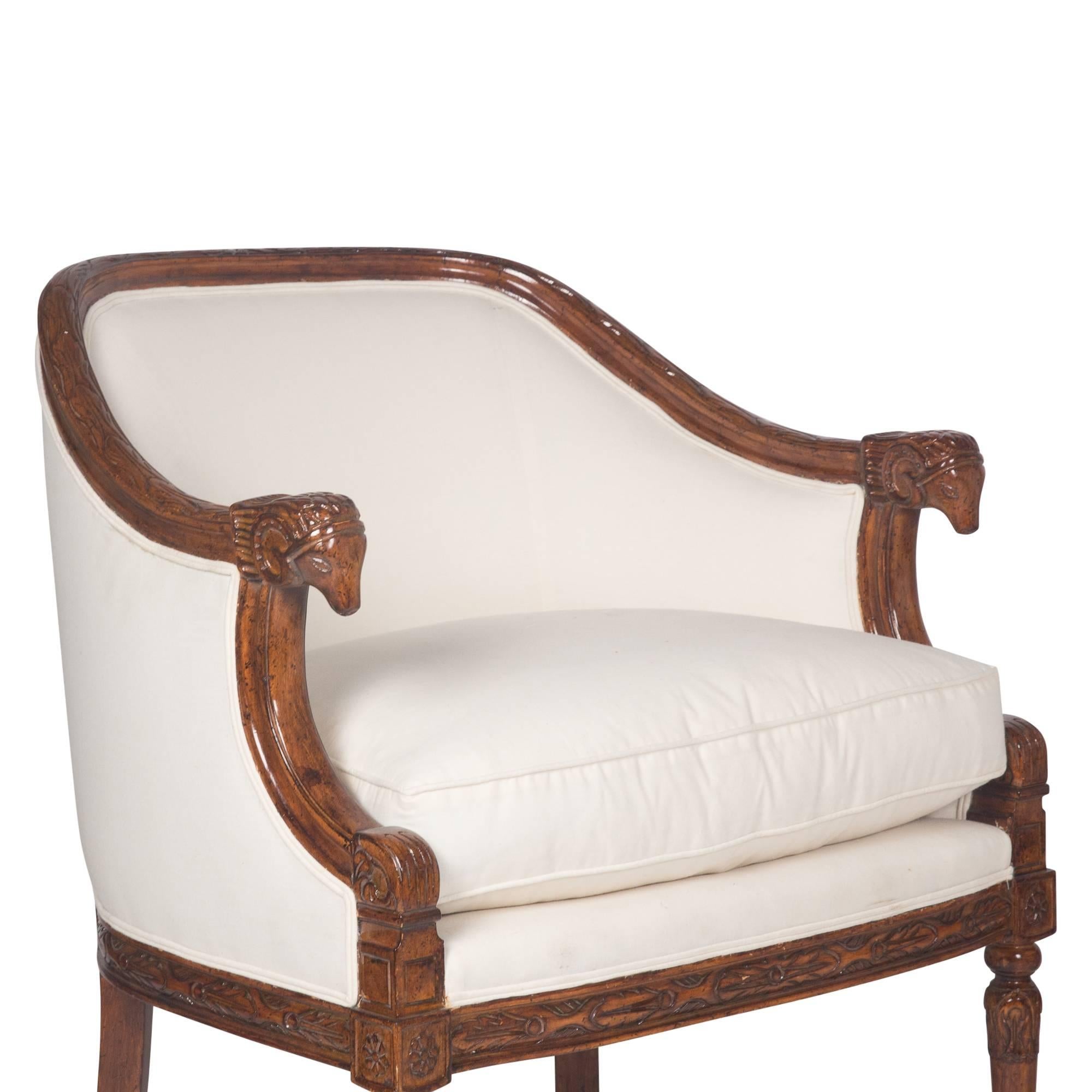 Pair of carved mahogany armchairs, round back, with carved animal head arm ends, fluted legs, German 1930s. Measures: Back height 32 in, seat heigh 20 in, width 27 in, depth 27 in.