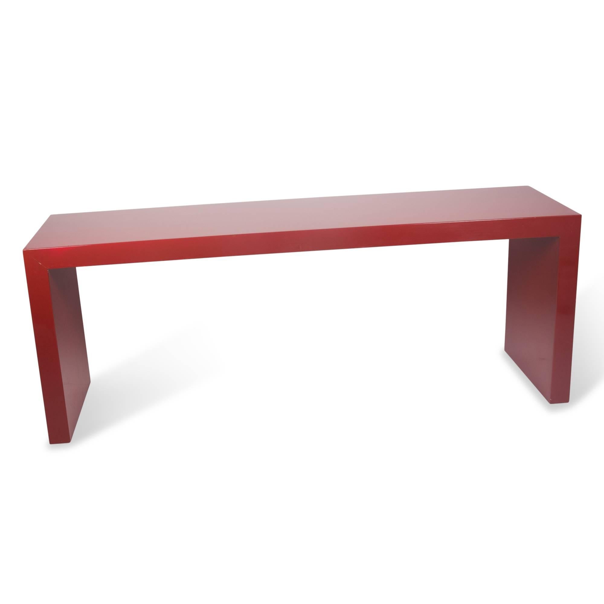 Red lacquered Parsons style console table, United States, 1960s. Measures: Length 72 in, depth 19 in, height 27 1/2 in.
