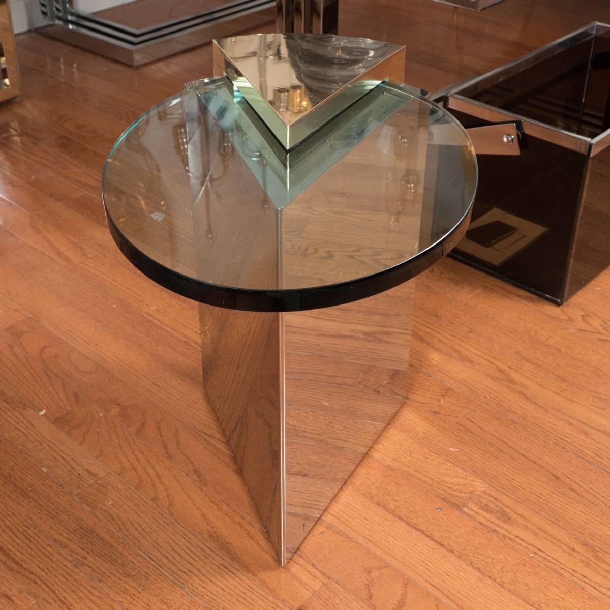 Pair of angular brass and chrome cantilevered side tables with oval glass tops.