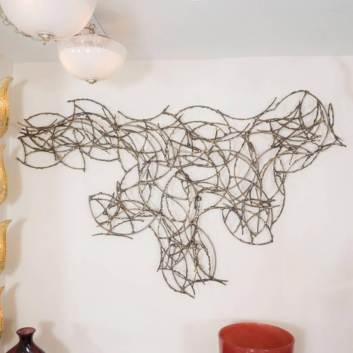 Abstract brass wire wall sculpture by Silas Seandel.