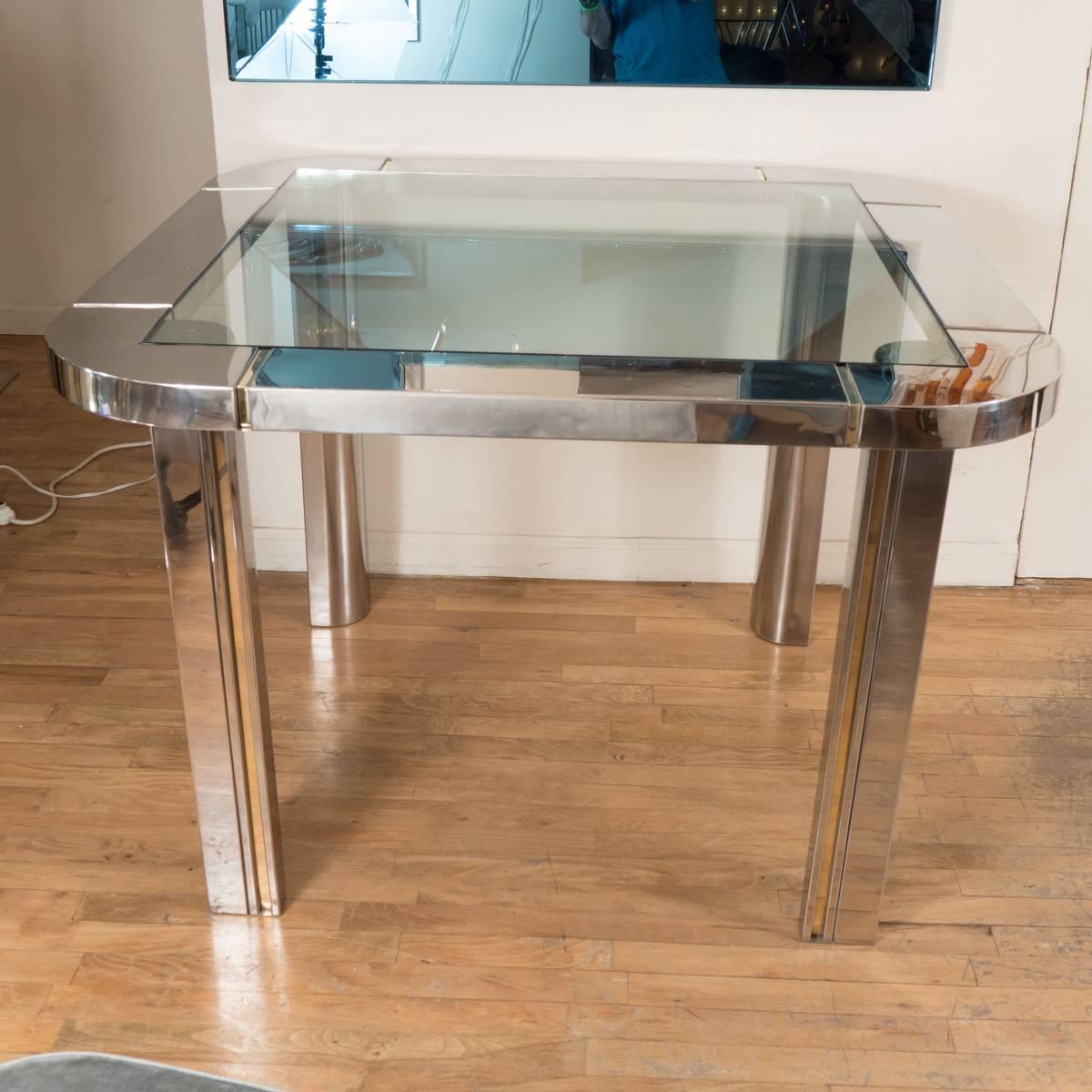 Polished nickel, brass, and glass centre or game table.