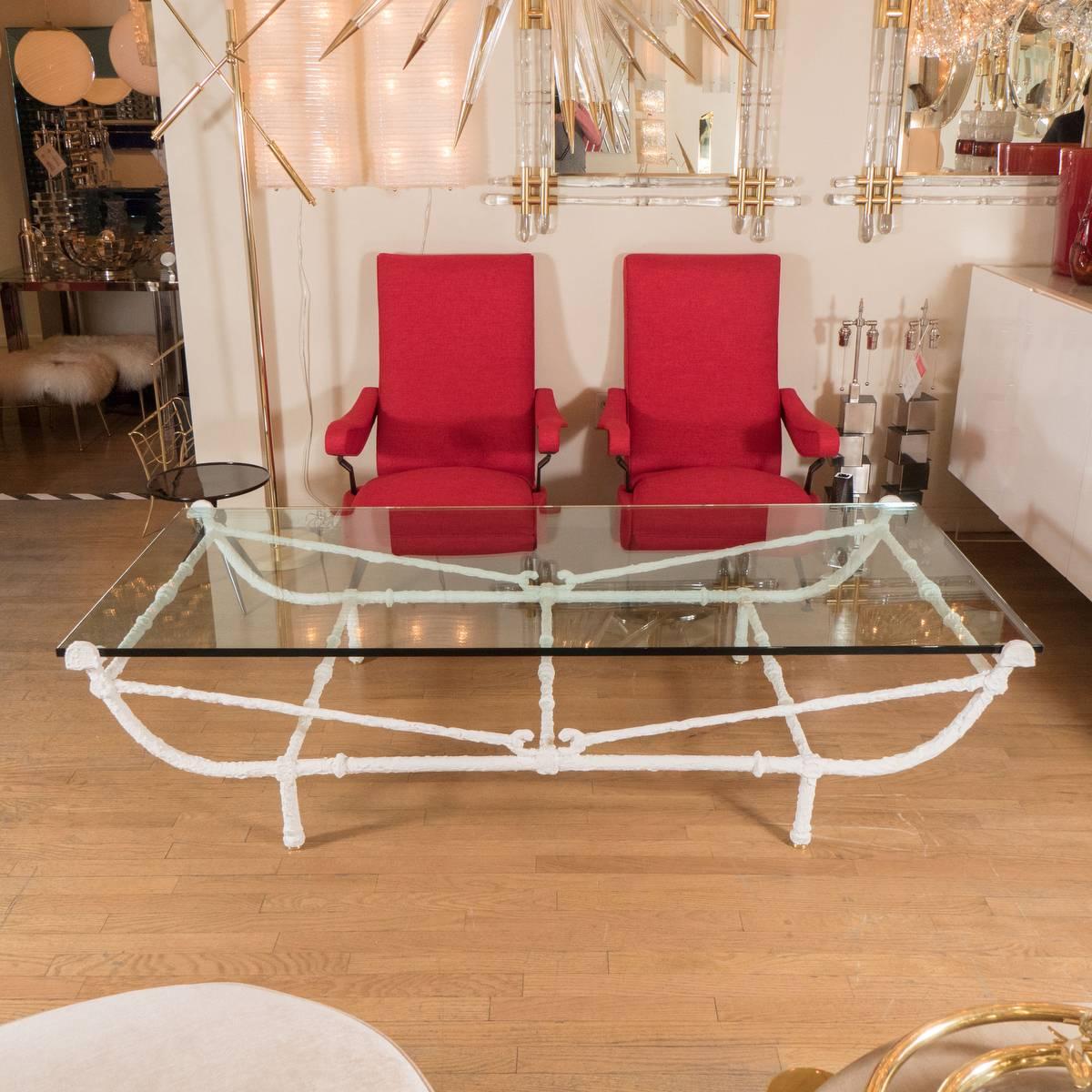 Rectangular white wrought iron coffee table with glass top in the style of Giacometti.