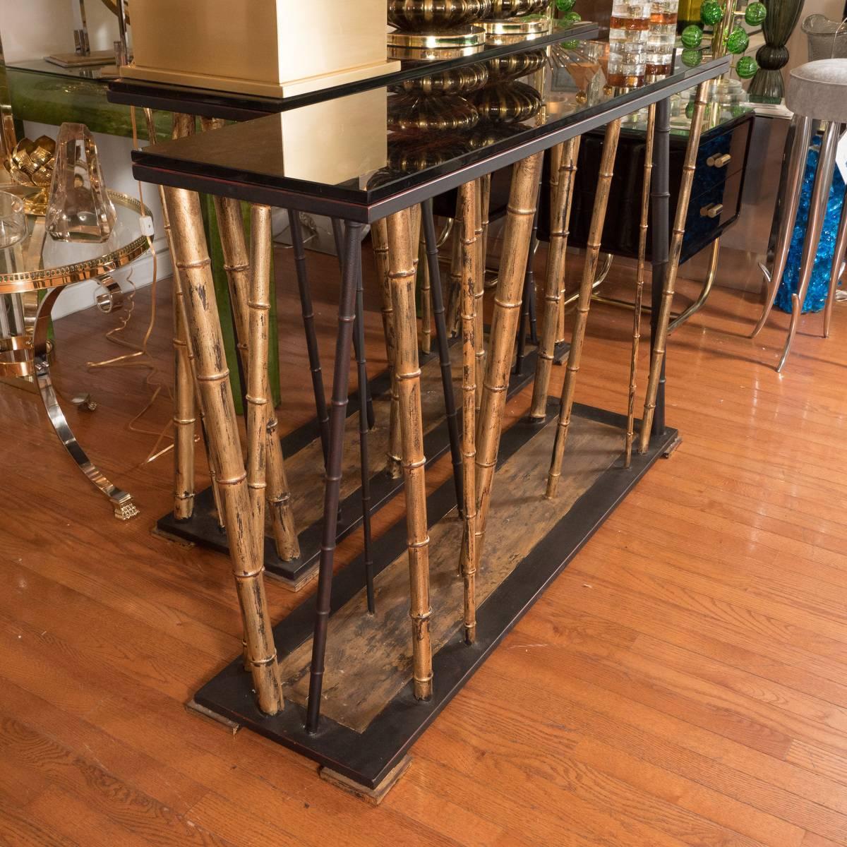 Gilt iron faux bamboo console table with reverse painted top.