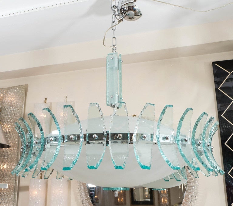 Large-scale chandelier with white frosted glass dome and green glass element surround and collar in the style of Fontana Arte.