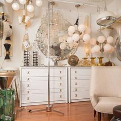 Chrome Painting Display with Articulated Light in the style of Arredoluce