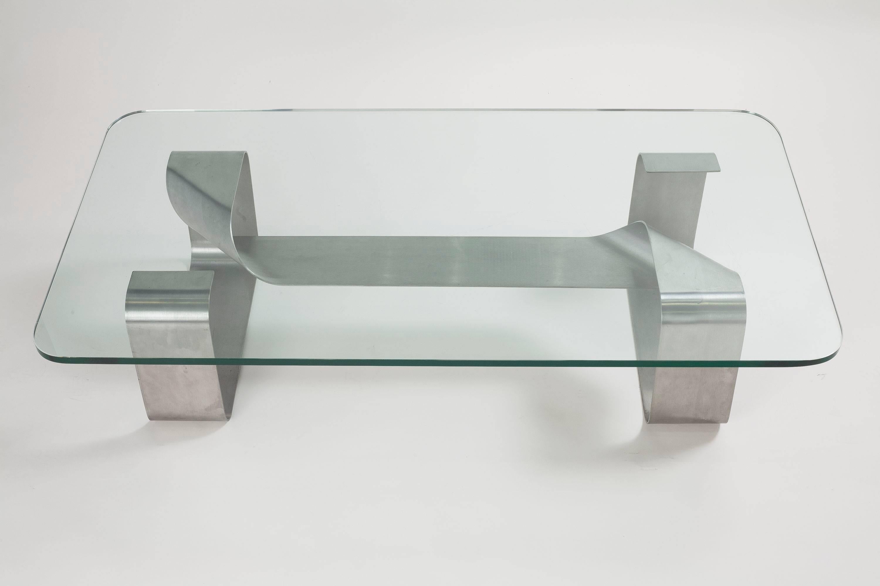 Steel base coffee table with a glass top, by Paul Legeard for DOM.