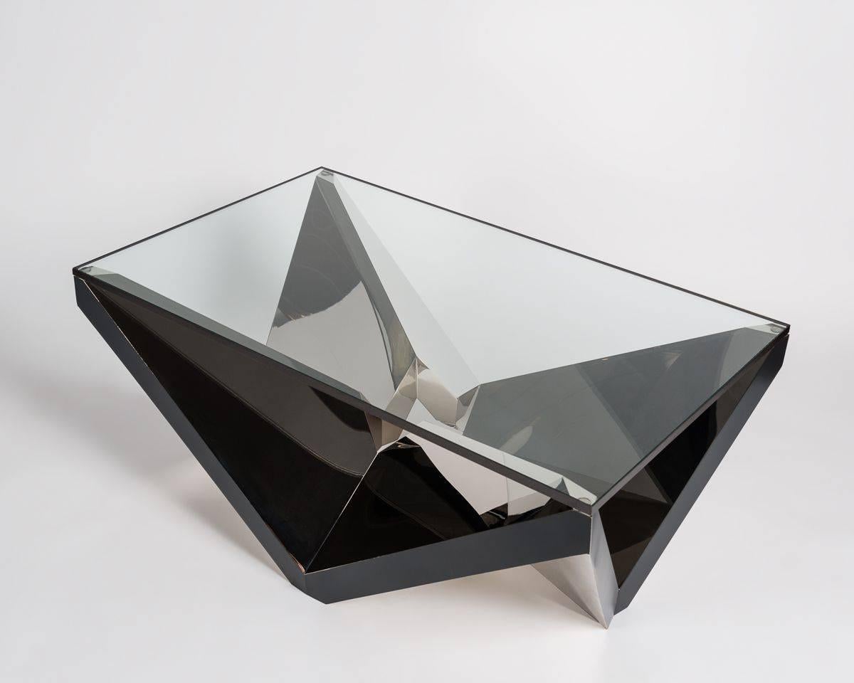Because of its many angles and broad reflective surfaces, this brilliant, nickel plated coffee table, made by Juan and Paloma Garrido of Spain, generates a dazzling array of planes of light.