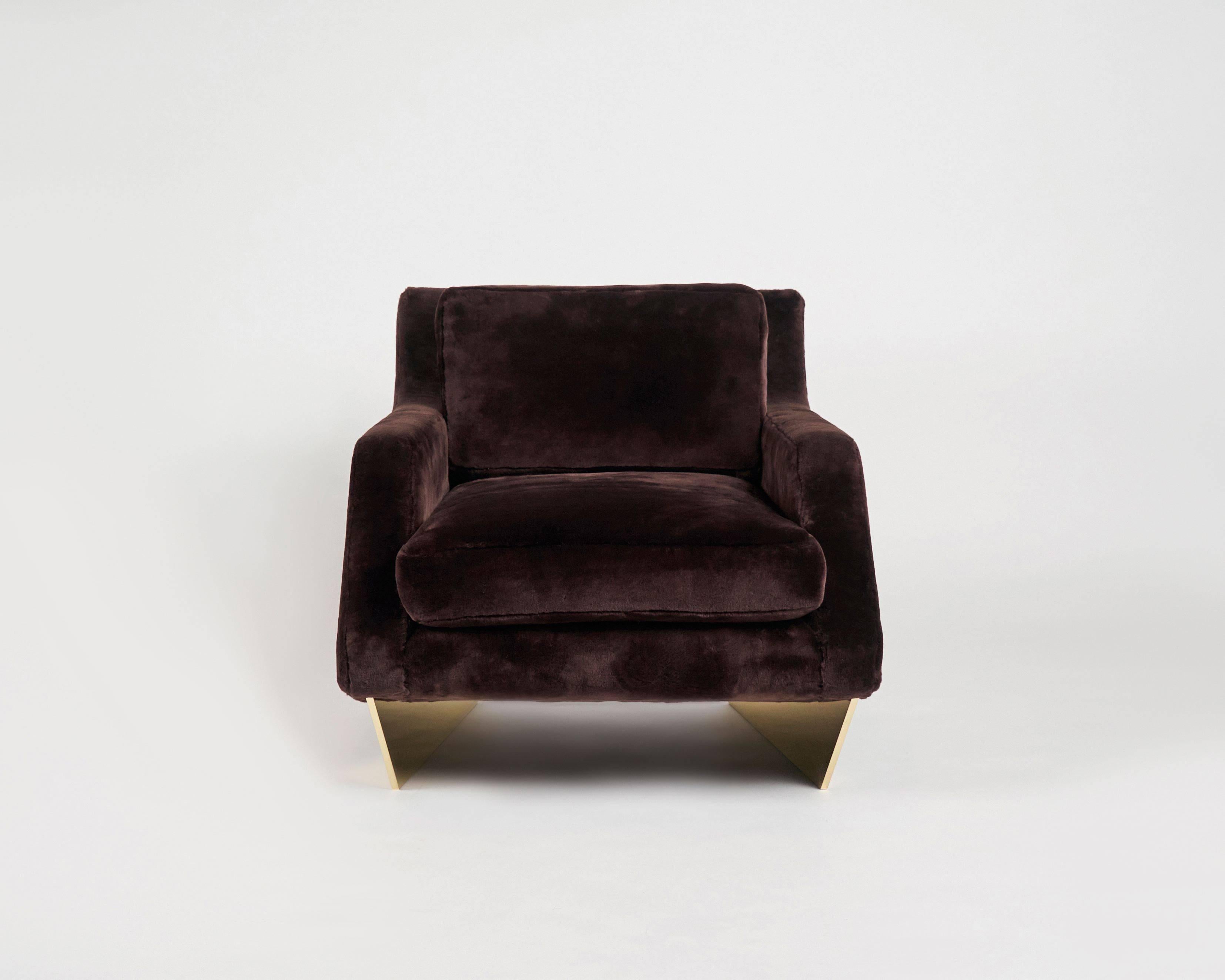 A companion to his well-known sofa, this fabulous armchair by architect William T. Georgis features an extra wide seat and rests on a pair of well-spaced, polished bronze legs.

Legs come in the following finish options:
Polished bronze
Satin nickel