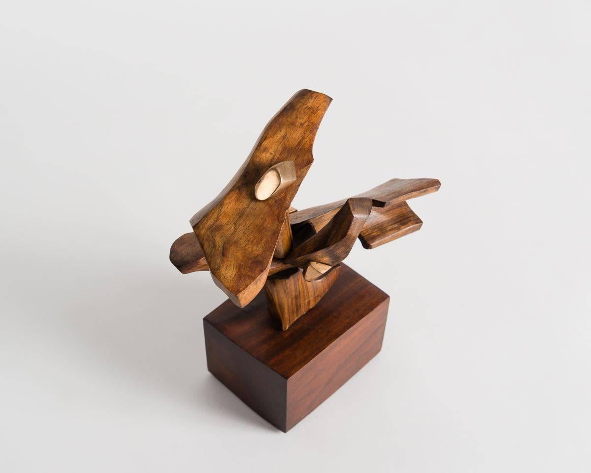 Unique piece.

Composed of walnut, this piece is an arrangement of walnut parts that move on a set of bronze hinges, the effect of which is that of a bird in flight.