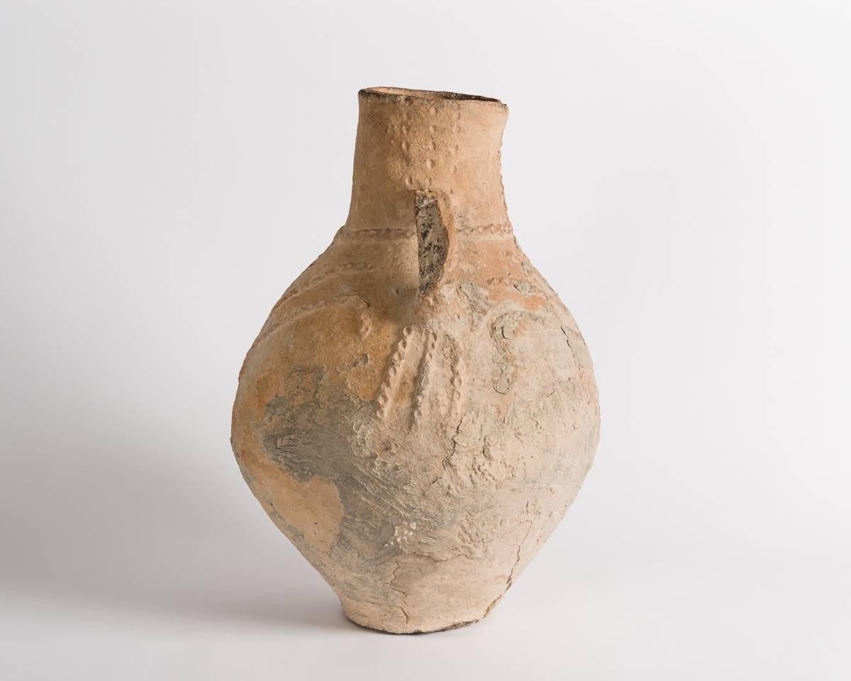 One of several ancient vessels, dating from the bronze age, and once held in famed designer Liz Claiborne's private collection, this piece is remarkable for its size, aesthetic balance, and intricate design.