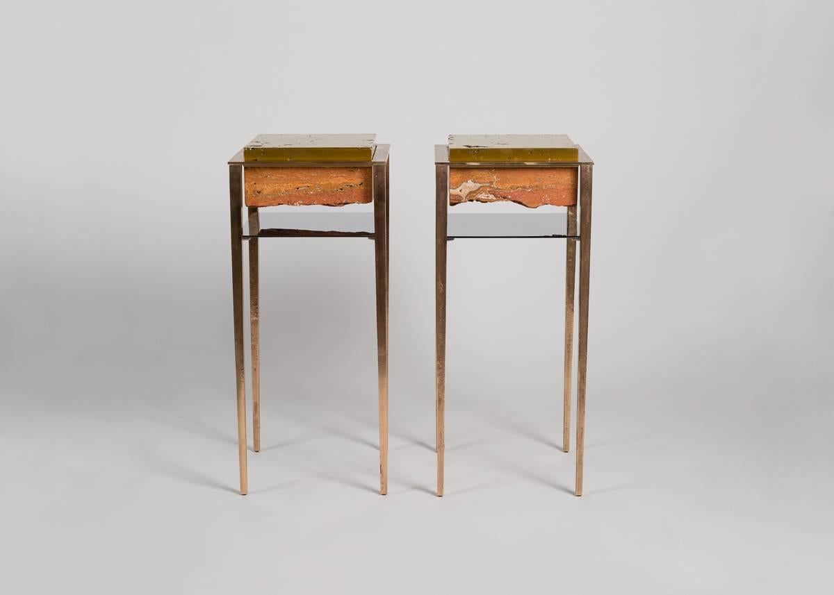 Each of Pacchioni's gueridons features a set of long, tensile legs, a porous bronze top and a polished shelf placed to reflect the rich colors of a roughly-hewn travertine block, the piece's inverted jewel.
