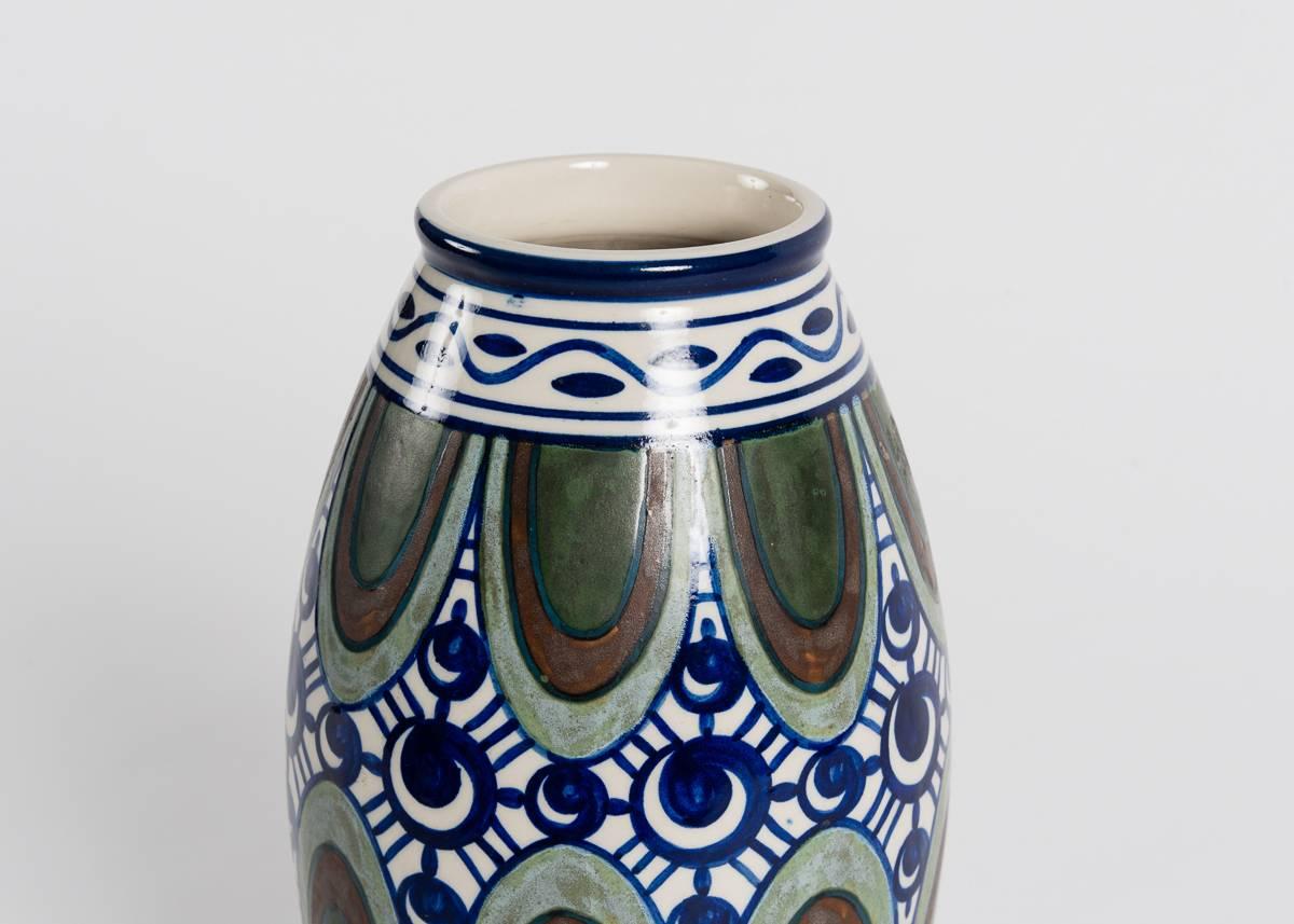 Fine Art Deco vase by French artist Charles Catteau.

Incised: Grès Kéramis / C
Marked with model number: D.654
Stamped with form number: 895.