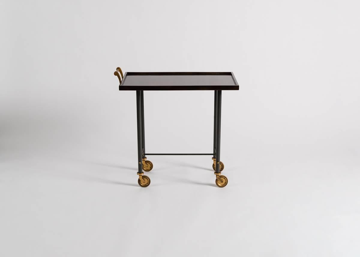 Unusual rolling bar cart by Maison Leleu in lacquer, gilt bronze, and gunmetal patina.