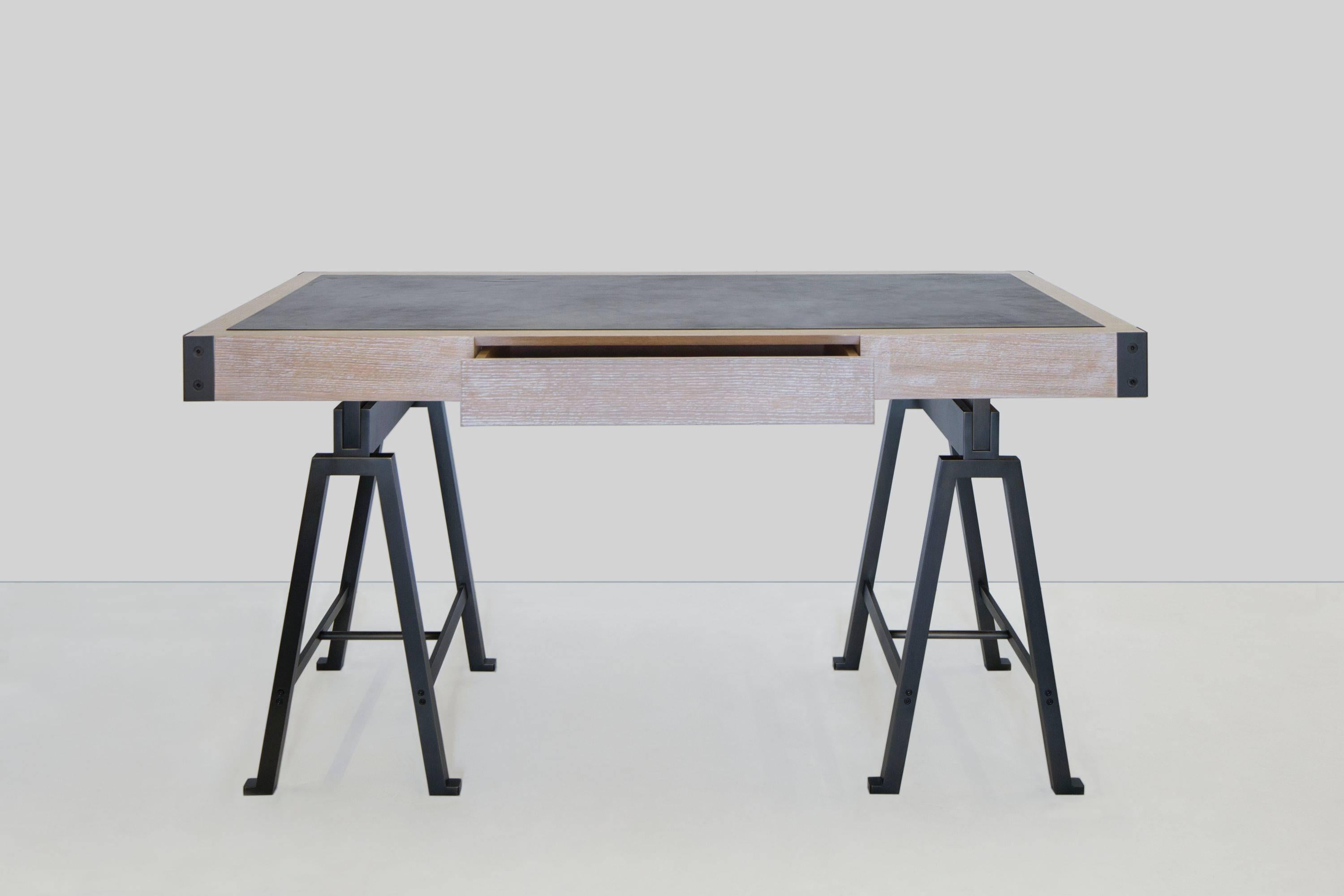 Desk by Mark Zeff in limed oak with a bronze base and leather top.  Please note that this item is made by order.
