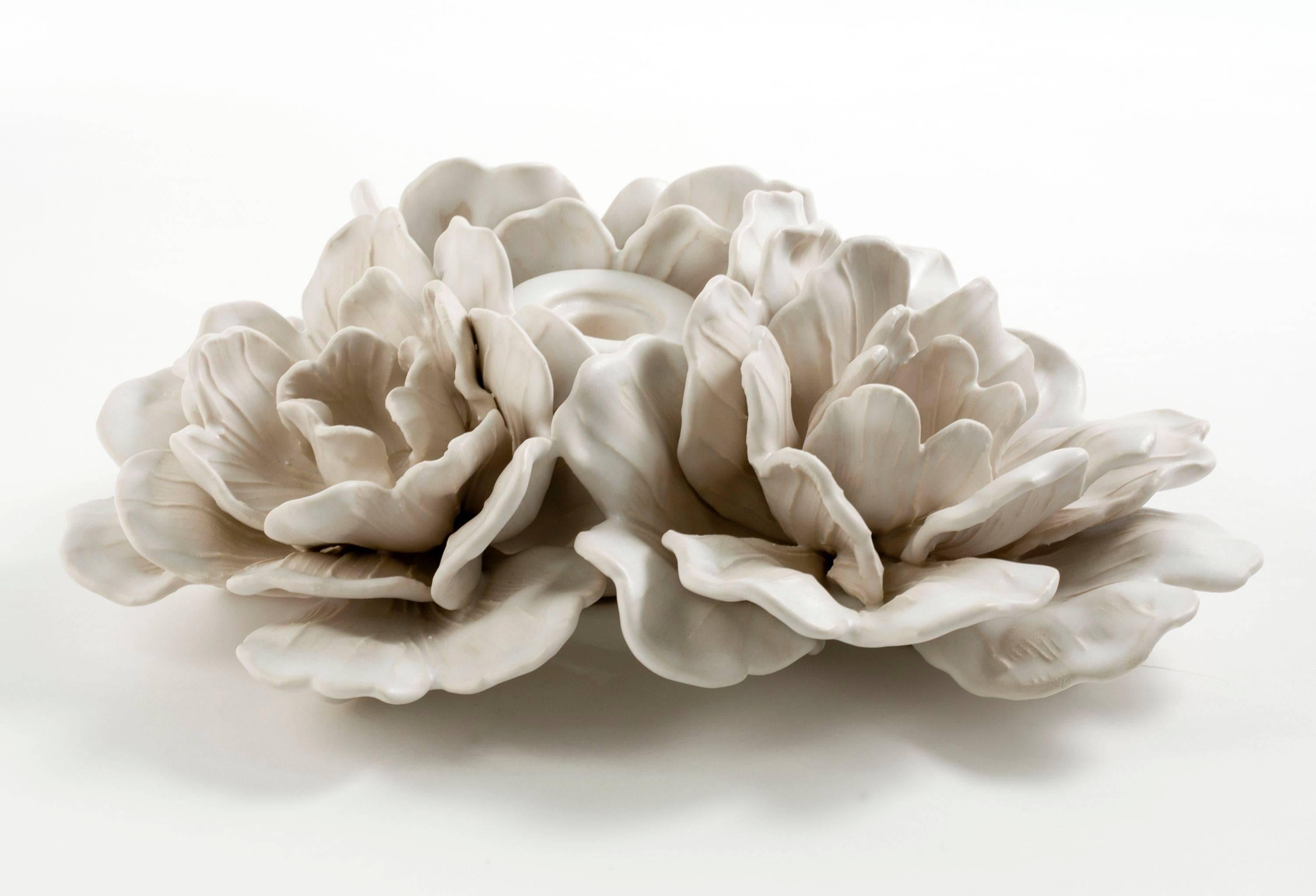 Glazed porcelain floral centerpiece with candle bobeche in the center, by Matthew Solomon. Signed and dated: Solomon '15. 

Using fine porcelain and glazes he crafted himself, Matthew Solomon translated the unruly beauty of nature into works both