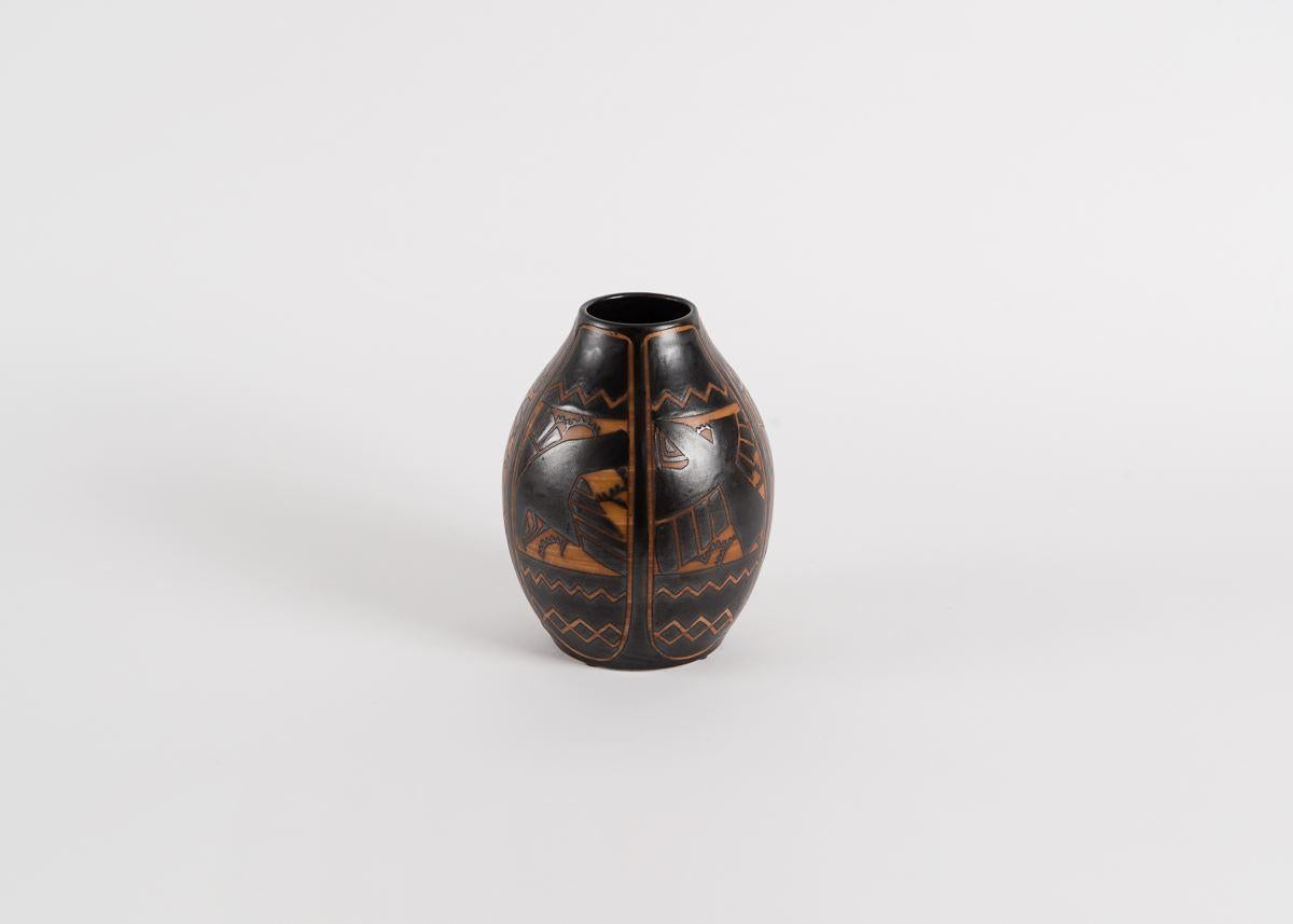 Signed in ink: Ch. Catteau
Marked in ink: D.1009 (design number)
Incised: Grès Kéramis and 901 (shape number)
Stamped: Boch F es La Louvière made in Belgium

This vase displays Catteau's design number D.1009, featuring birds against stylized foliage