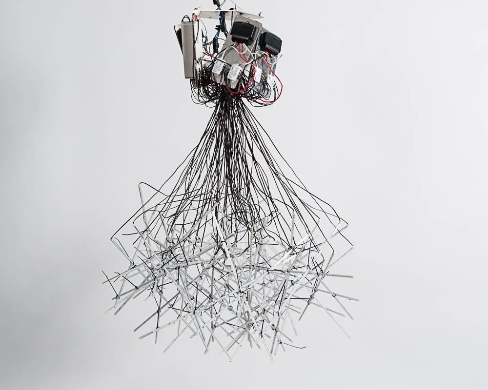 Fractal Cloud is composed of a profusion of intersecting LED strips, which hang from a raw, exposed transformer. Arik Levy’s sculptural chandelier is a piece of astonishing power—a piece characterized by its seeming contradictions. Its unabashed