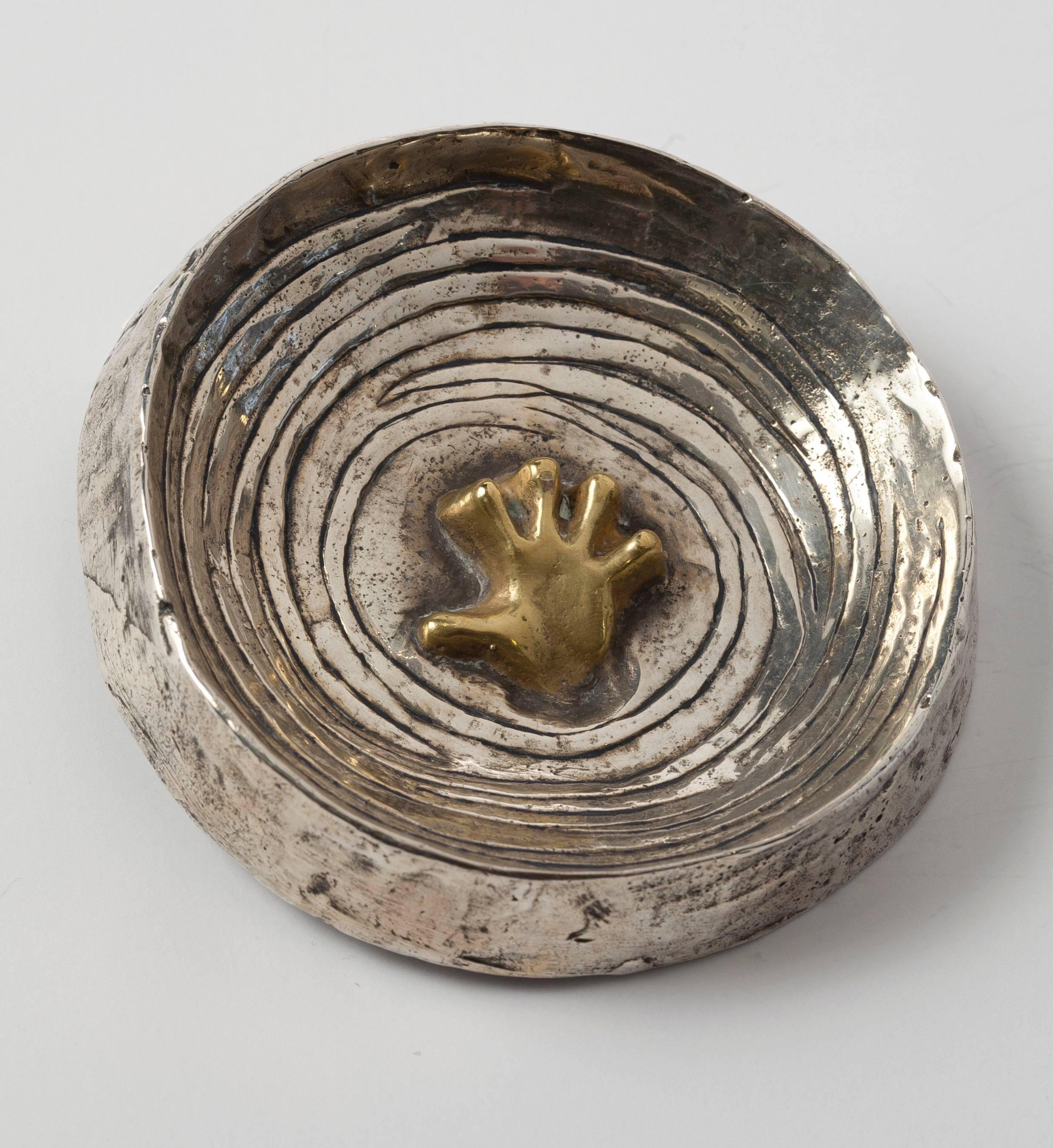 "The Hand in the Waves"
A bronze doré and argenté tray by Line Vautrin