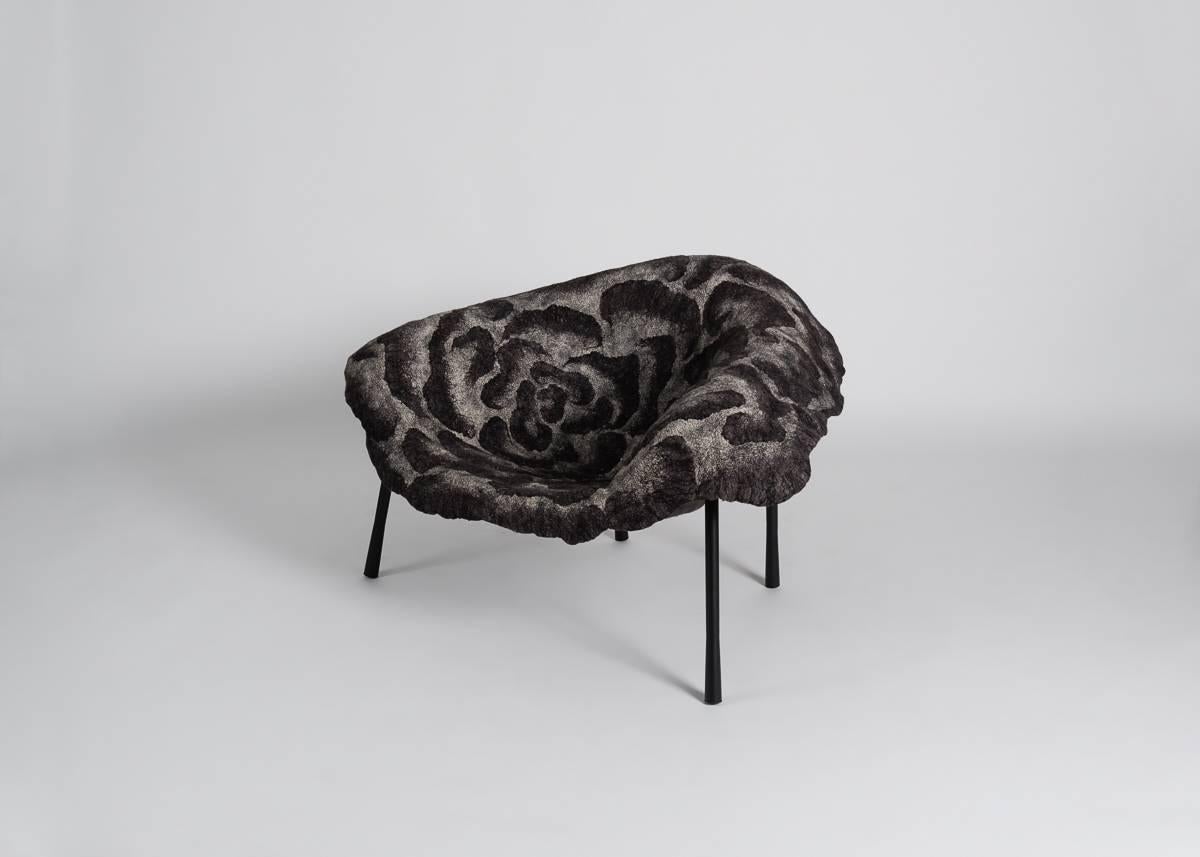 Unique piece.

The upholstery of this chair, made of finely woven layers of felt, mimics forms in nature, which, like seabed coral, develop over years of accretion.