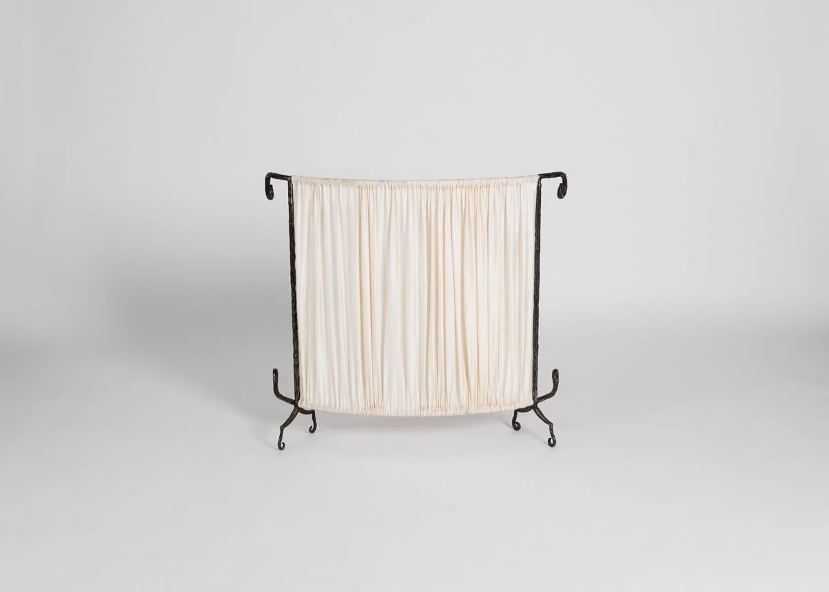 A set of three elegant radiator covers with curlicue wrought iron frames, and original beige fabric, from the famed design duo for the 1980s and 1990s.
  