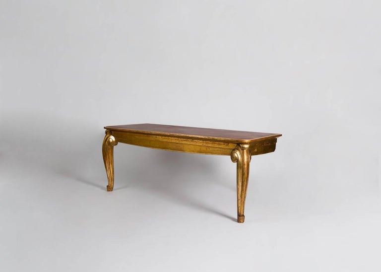 One of a pair commissioned by Jean Patou for his Paris maison de couture.

Please note that our console retains its original traditional water gilding, creating an effect which is part matte and part burnished. The matte areas bear the original