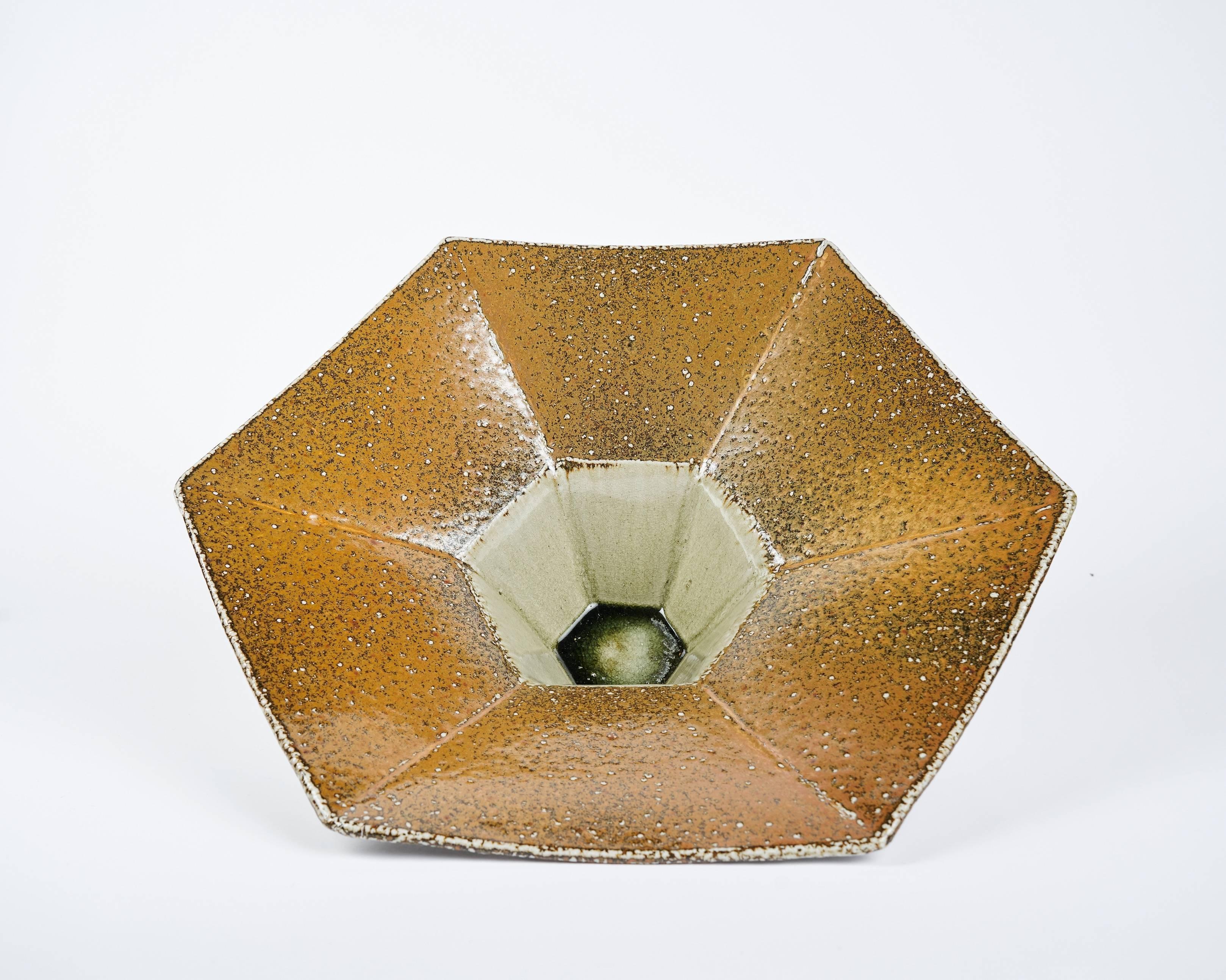 This twisted, faceted vase by contemporary Danish ceramicist Aage Birck, possesses a rigidity and texture unique for the medium.