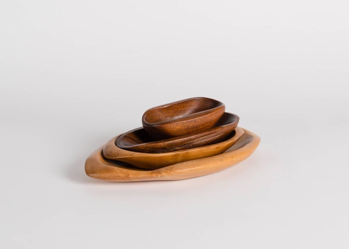 A set of hand-carved, sculptural bowls, made to nest in one another and created, circa 1920.