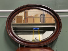 Vintage Oval Wood Bevelled Hanging Mirror With Metal Decoration 