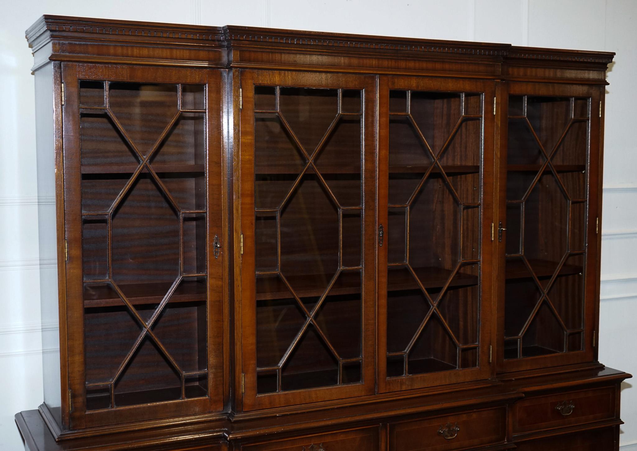 
Antiques of London



We are delighted to offer for sale this Stunning Georgian-Style Breakfront Display Cabinet Bookcase. 

This elegant piece features a prominent breakfront design, enhancing its visual appeal. It boasts four glazed doors,