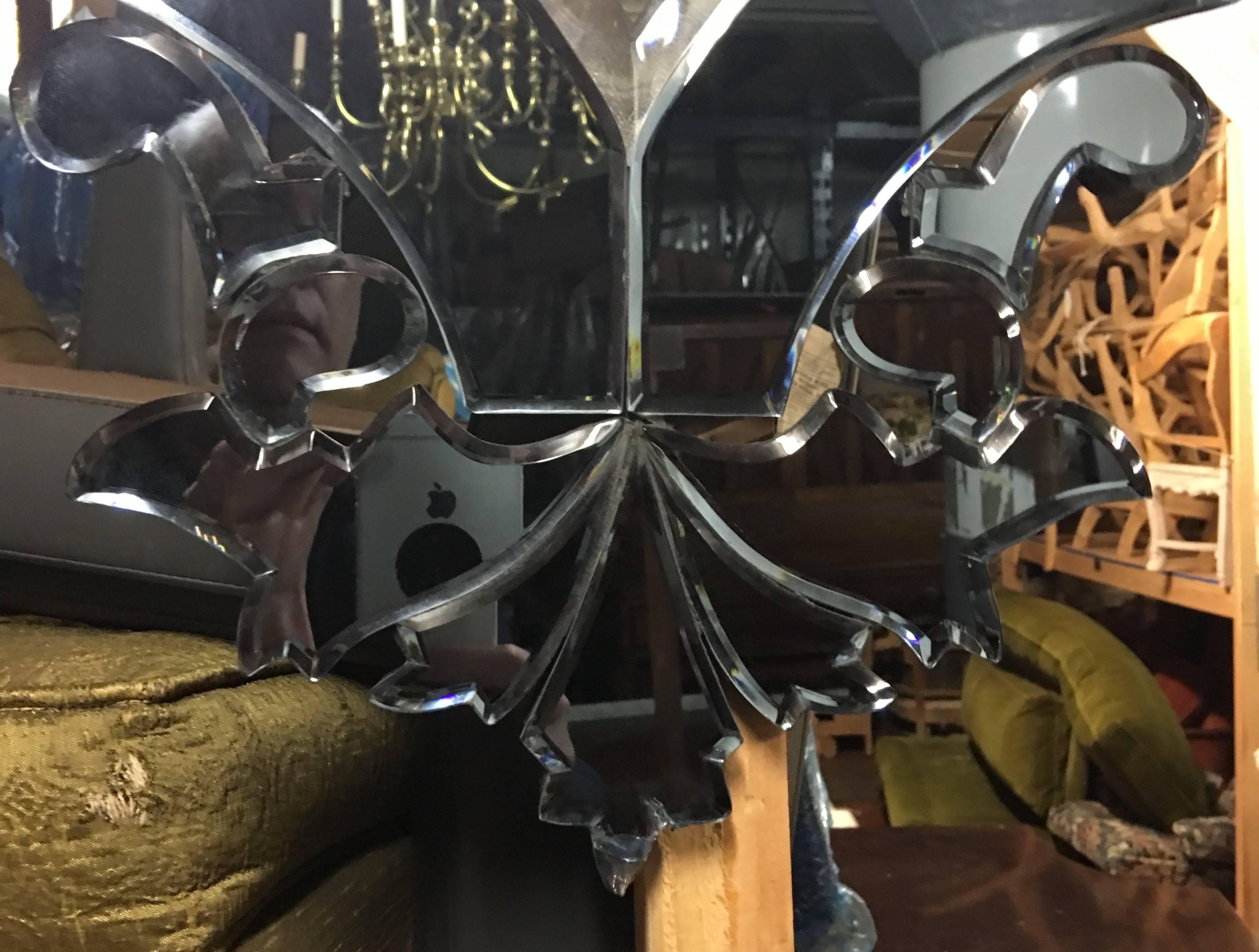 An estate Pair of Mirrors solid wood back plate over laid with hand cut mirrors in Venetian style.Blue glass stylized acanthus leaves.
surround a center cartouche.