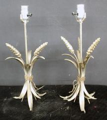 Two metal lamps with a bunch of wheat at base and new shade.