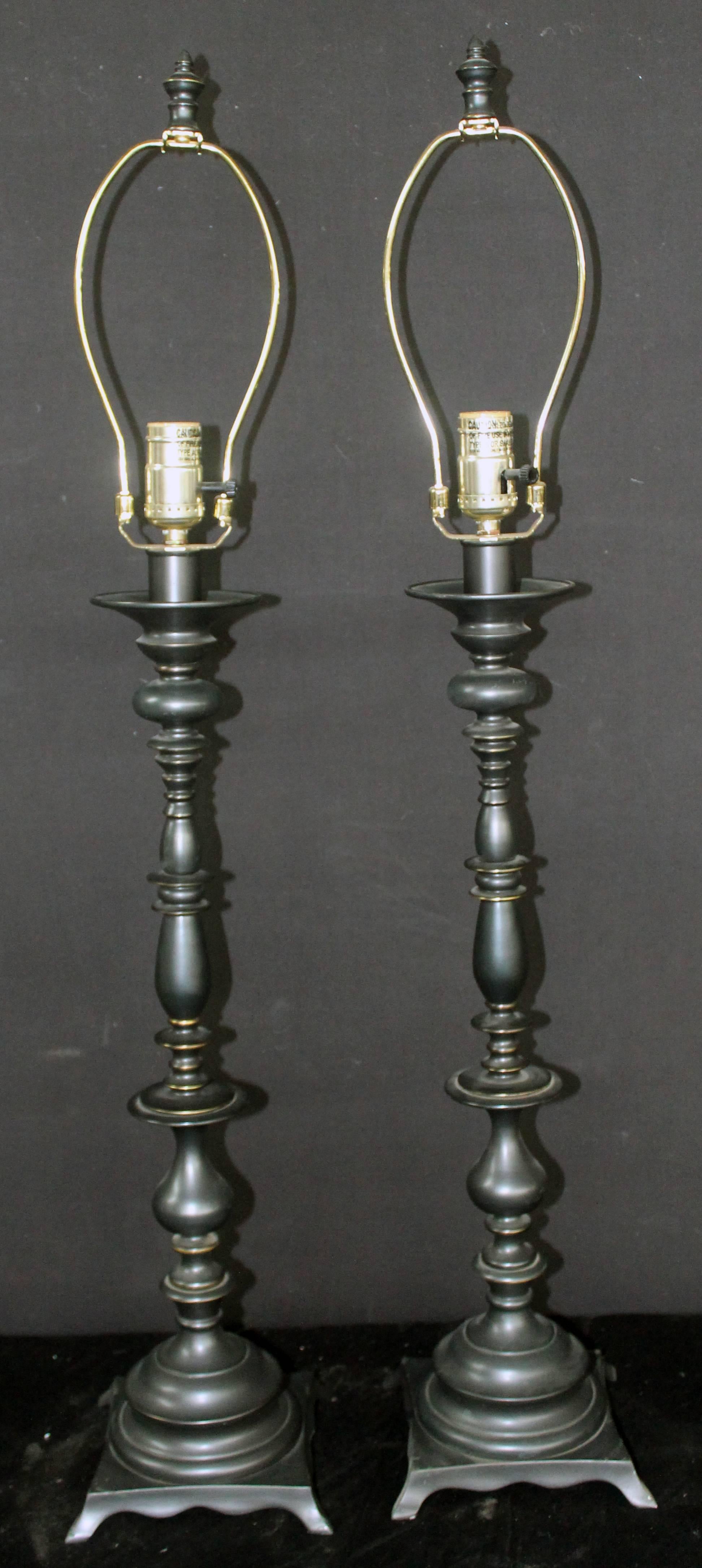Pair of ornate traditional metal lamps.

Base is 7