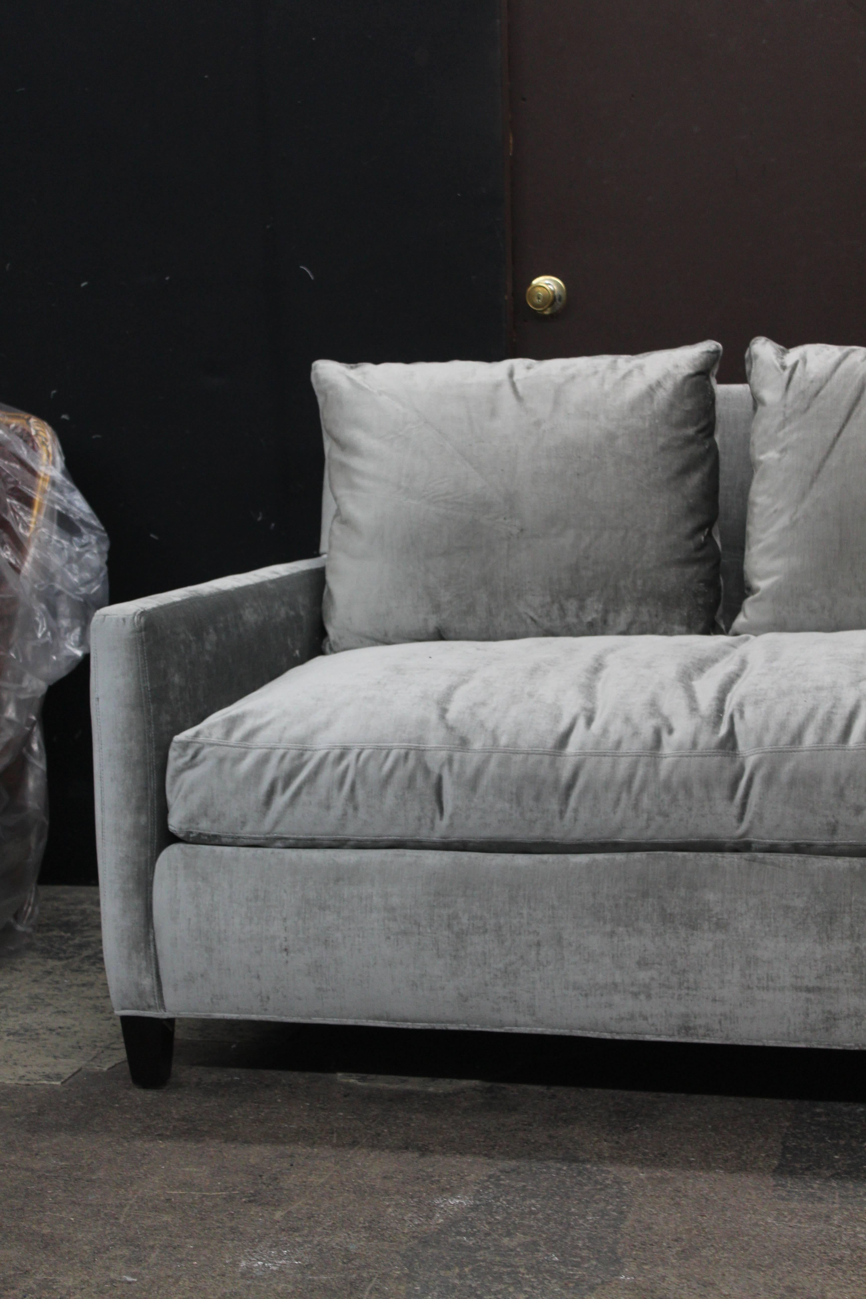 Long and luxurious sofa in silver antique velvet. Seat cushion composition is foam core/down wrap, back cushions are down/down/feather. Top stitch detail throughout. Newly reupholstered.