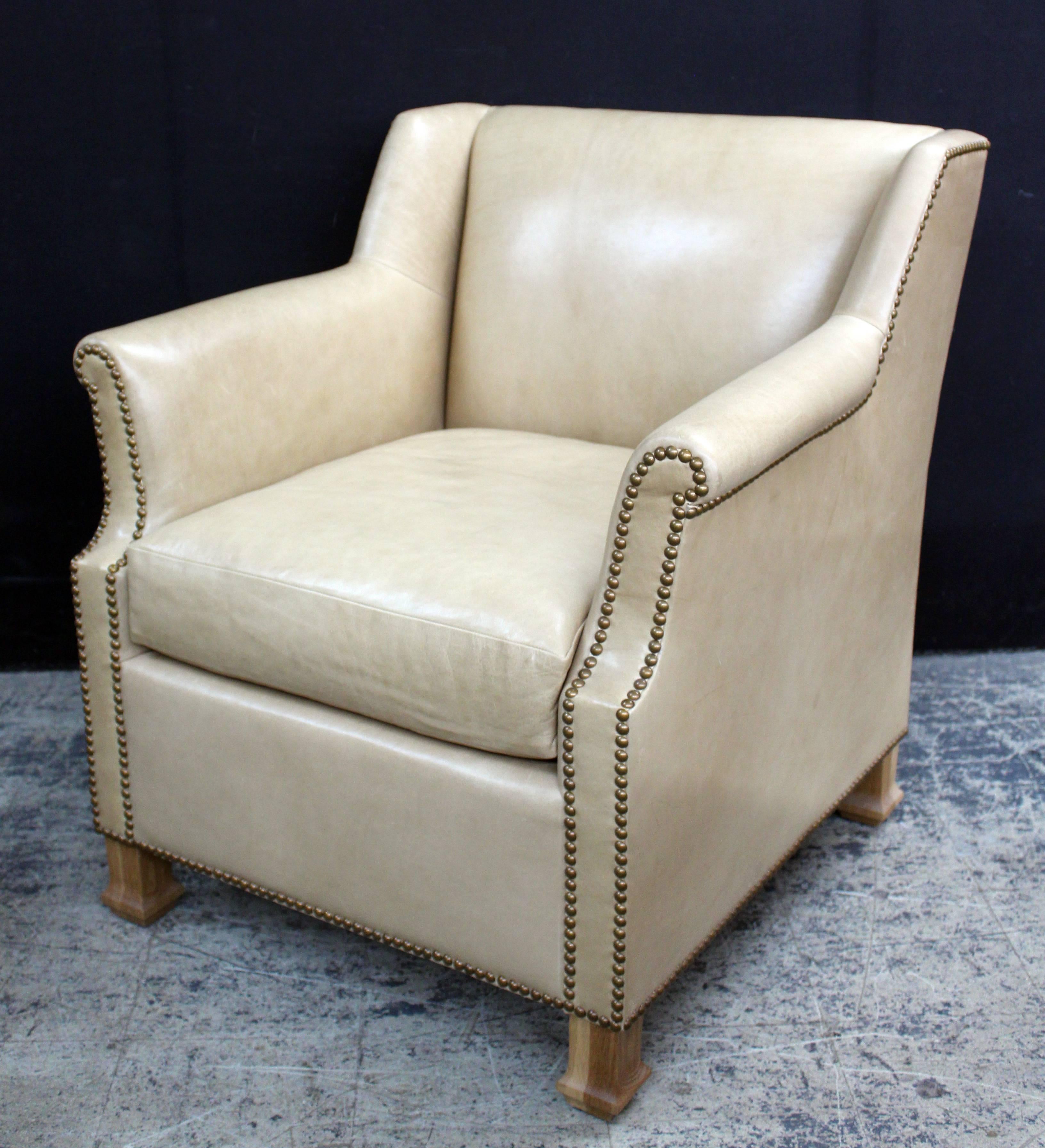 Pair of custom leather club chairs in a butter soft 