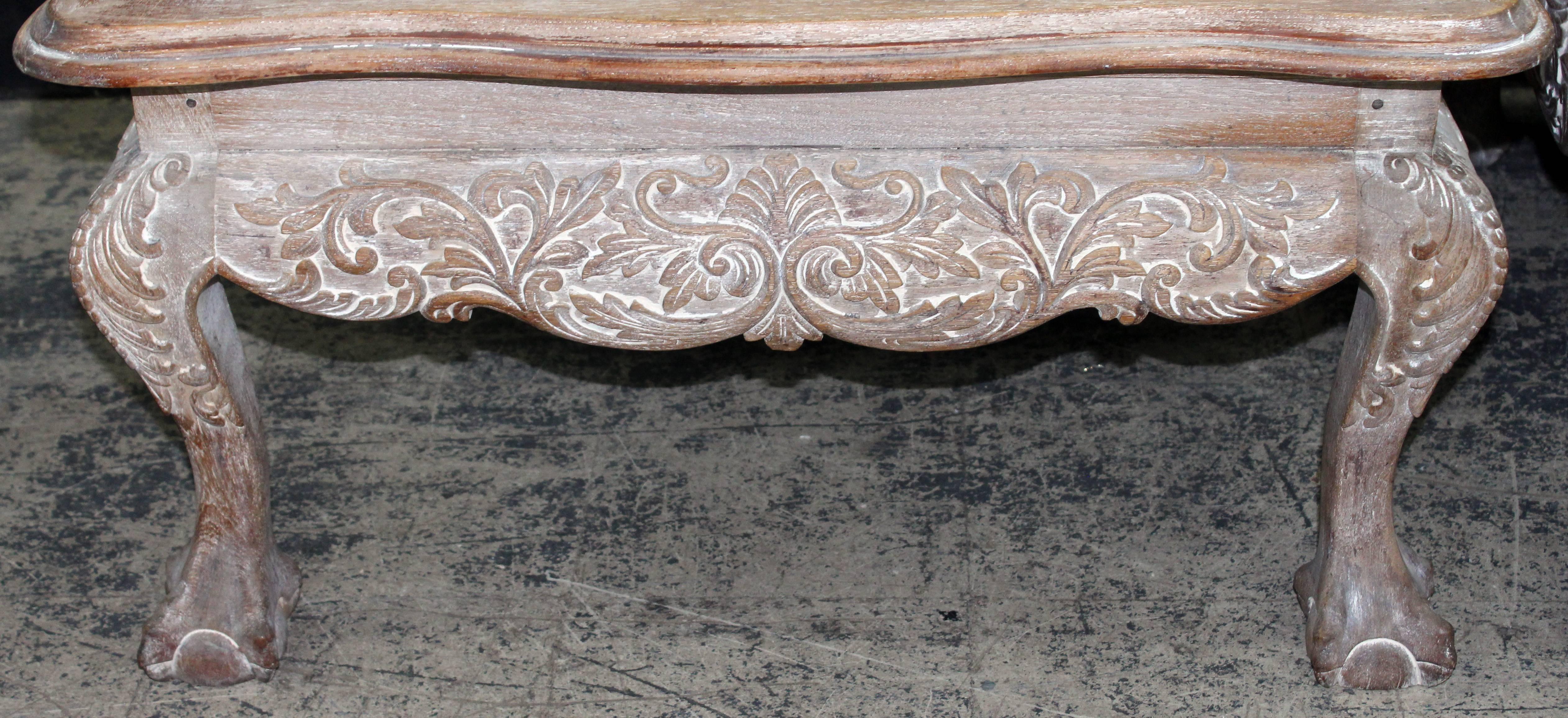 Pair of finely details Portuguese cerused mahogany benches upholstered in a faux leopard fabric.