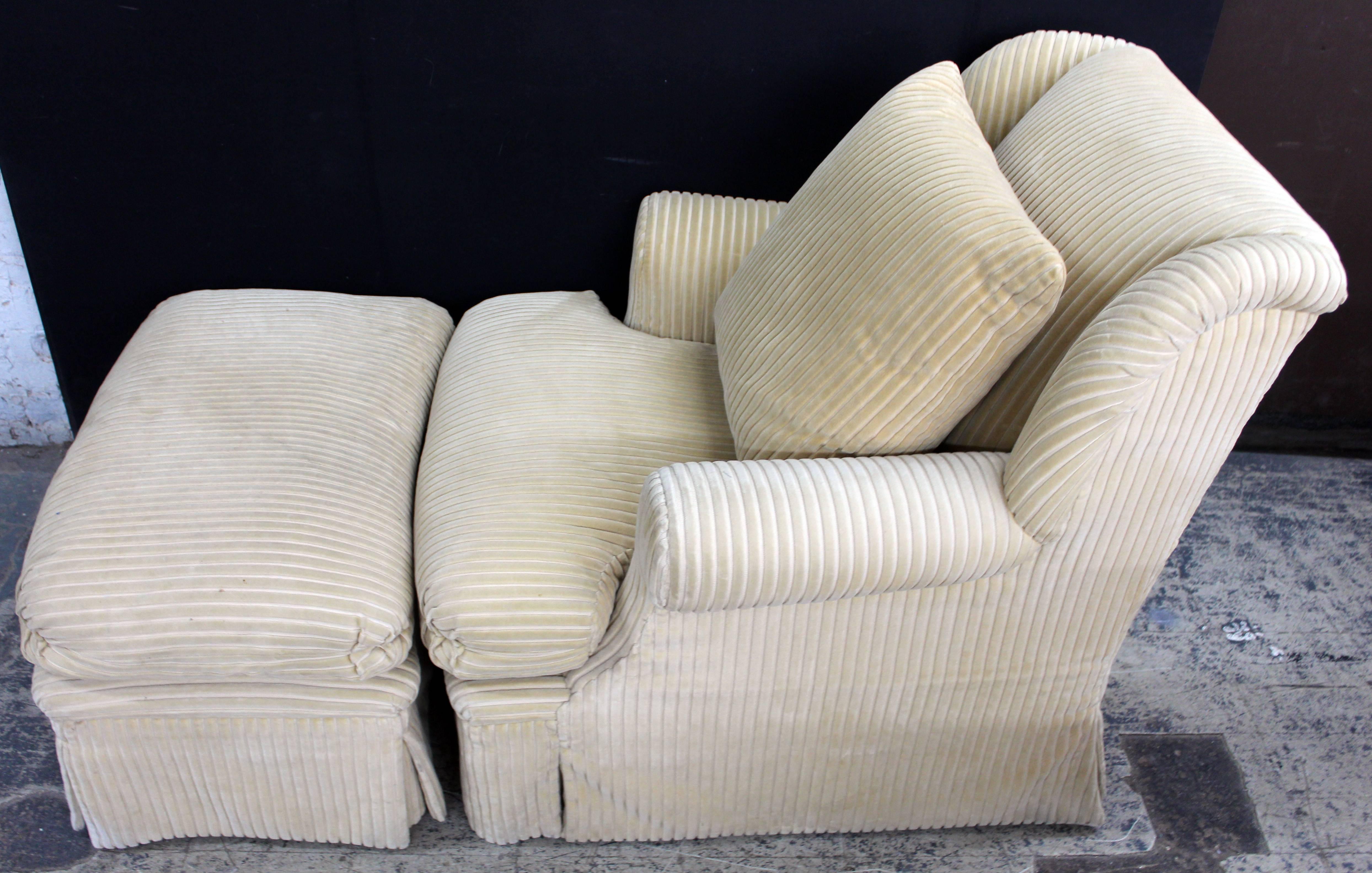 Large and comfortable club chair and matching ottoman by Dessin Fournir. The fabric is a rich golden velvet corduroy. The cushions are foam core/down wrap. The large pillow is 50/50 down/down feather. The fabric is in very good condition. Should you