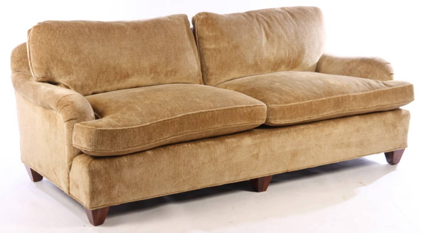 A good quality upholstered Bridgewater style sofa having loose cushion back and seat The seat and back composition is down/down feather. The current upholstery is in a deep Golden chenille.