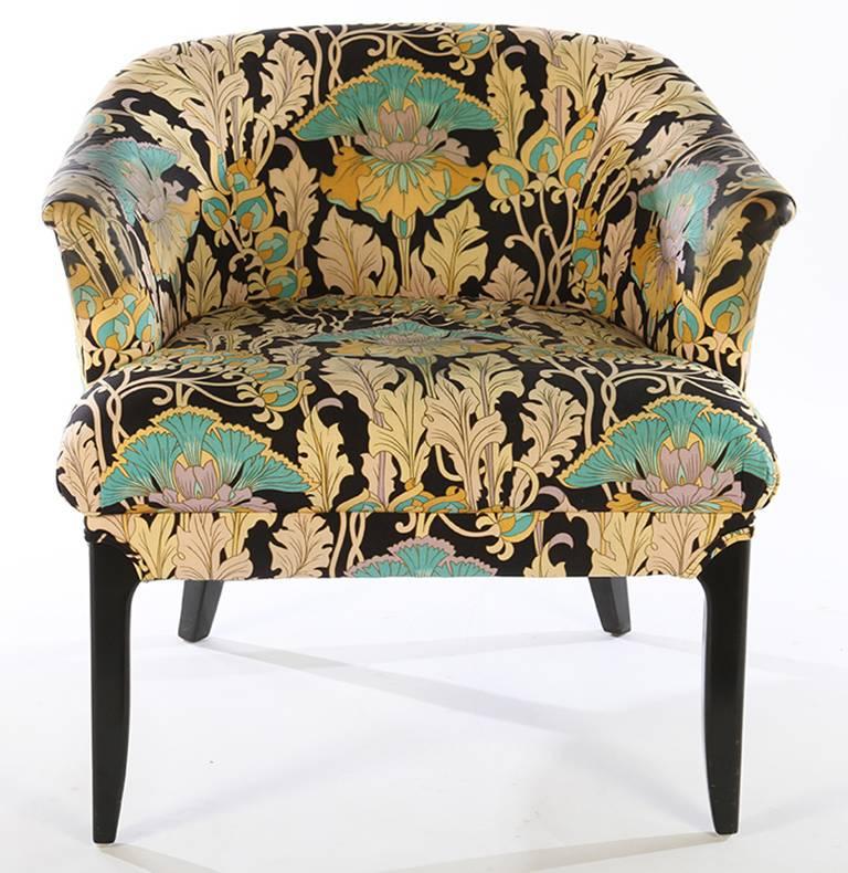 Pair of chic occasional chairs with ebonized legs.